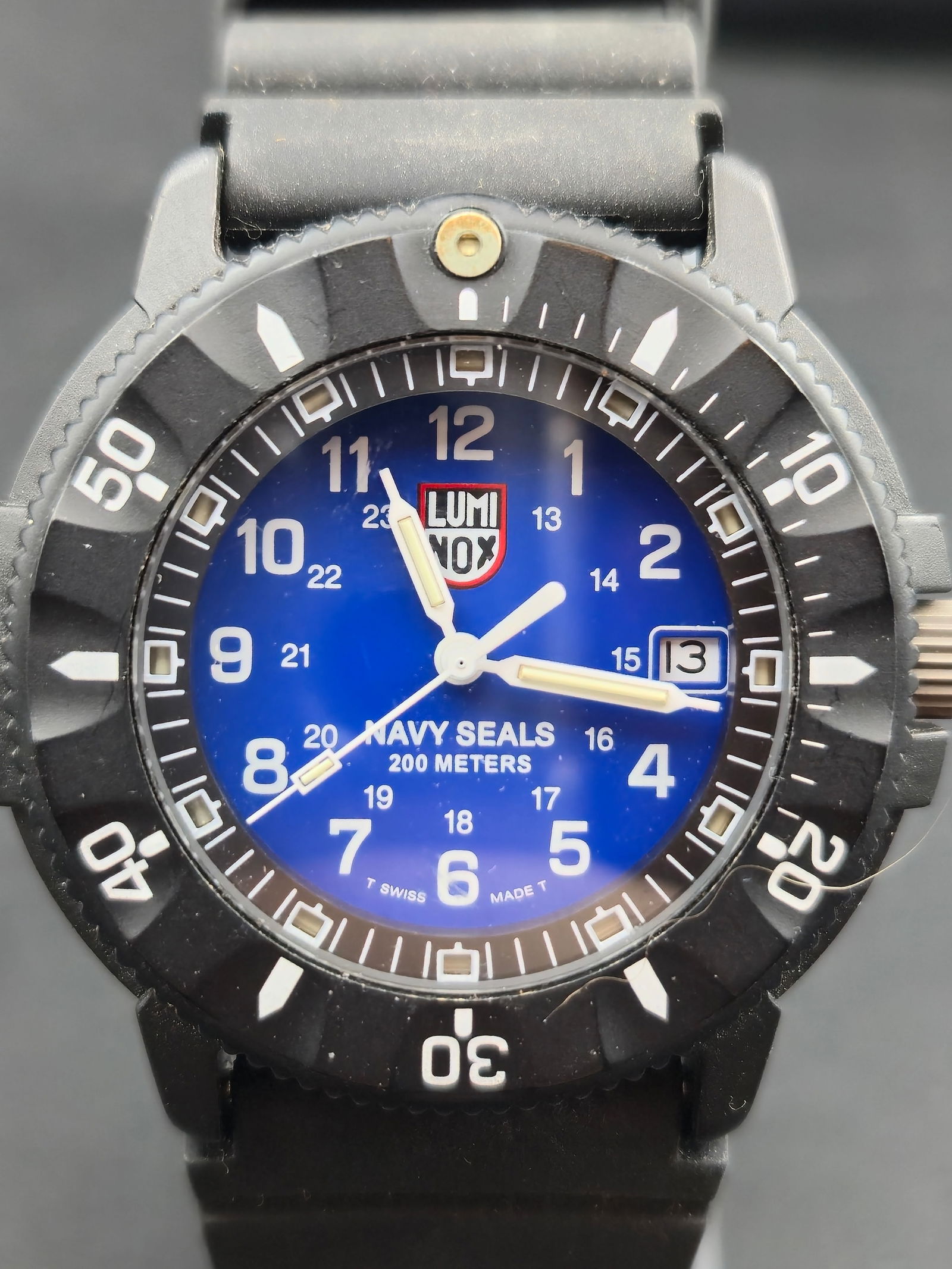 NOS Luminox Navy SEALs Series 3900 42mm 200M Blue Dial Swiss Quartz Full Set: New old stock Luminox Navy SEALs Series 3900 Swiss made quartz dive watch with blue Navy SEAL dial, black composite case, and unidirectional rotating bezel. Caseback engraved Series 3900 with Navy SEA