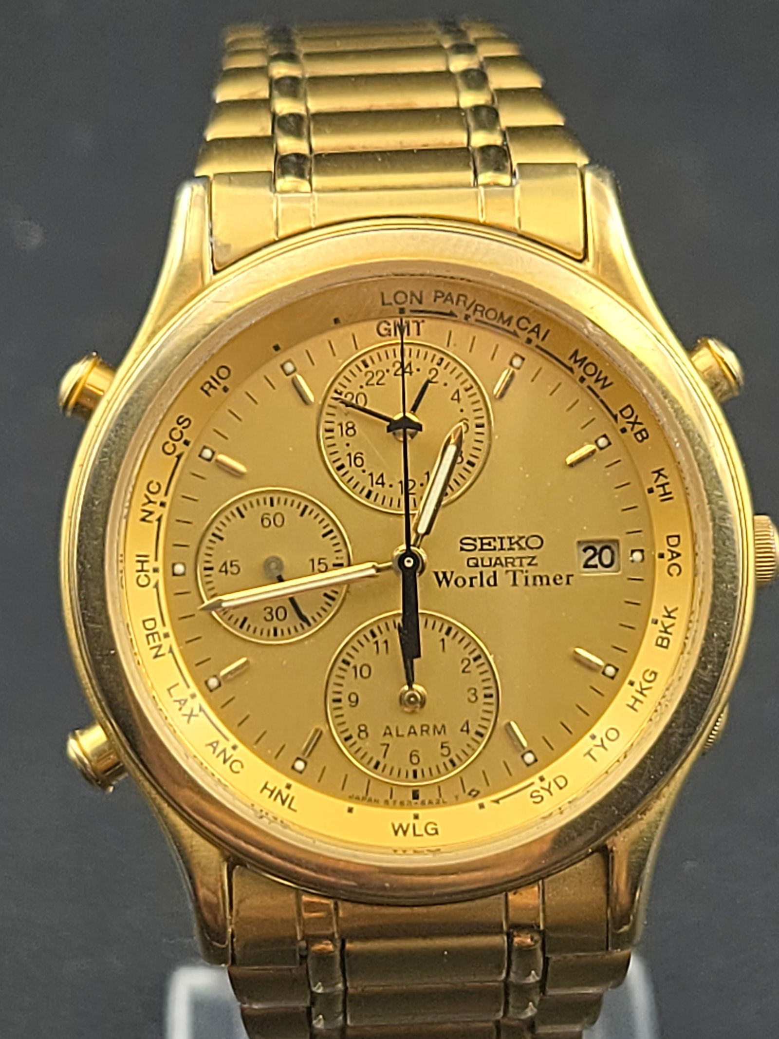 Seiko 5T52-6A29 Quartz World Timer Alarm Chronograph 37mm Gold Dial 007 Style Traveler Watch: Vintage Seiko Quartz World Timer chronograph featuring the multifunction 5T52 movement with world time bezel, alarm, and chronograph capability. The dial displays a gold-tone layout with multiple subd