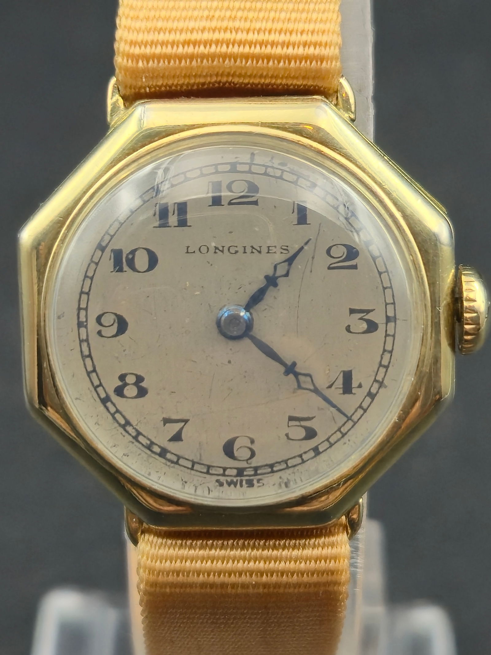 1920s Longines Art Deco Cushion Case 15J Manual 24mm Wadsworth 14K Gold Filled: Vintage Longines Art Deco wristwatch featuring a classic cushion-shaped case and enamel-style dial with bold Arabic numerals and blued hands. The dial is signed Longines and marked Swiss at the bottom