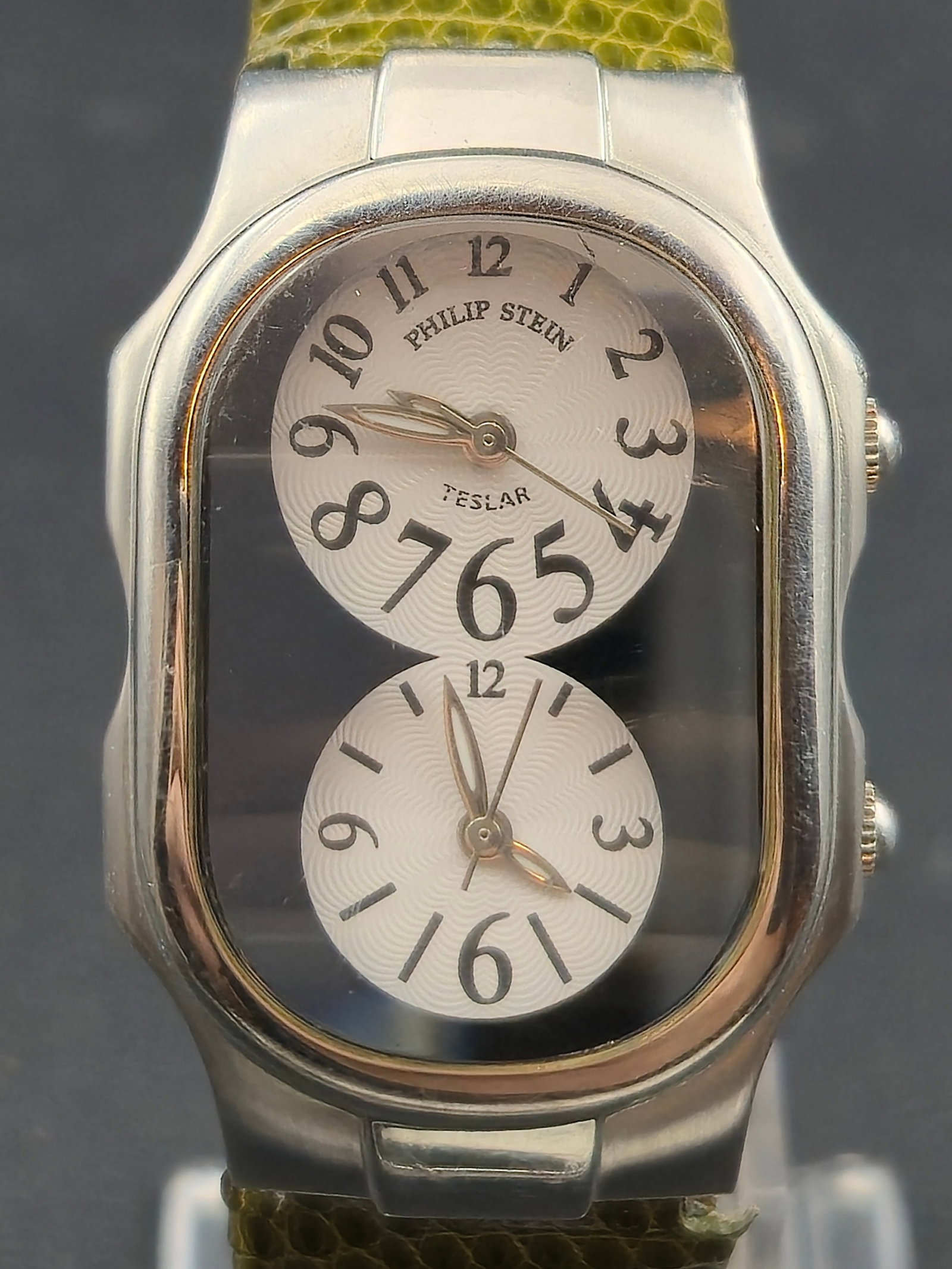 Philip Stein Teslar Dual Time EMF Protection Watch Model 101367 26mm: Philip Stein Teslar dual time wristwatch featuring the brand’s signature two dial design. The upper dial displays the primary time while the lower dial displays a secondary time zone. The dial is si