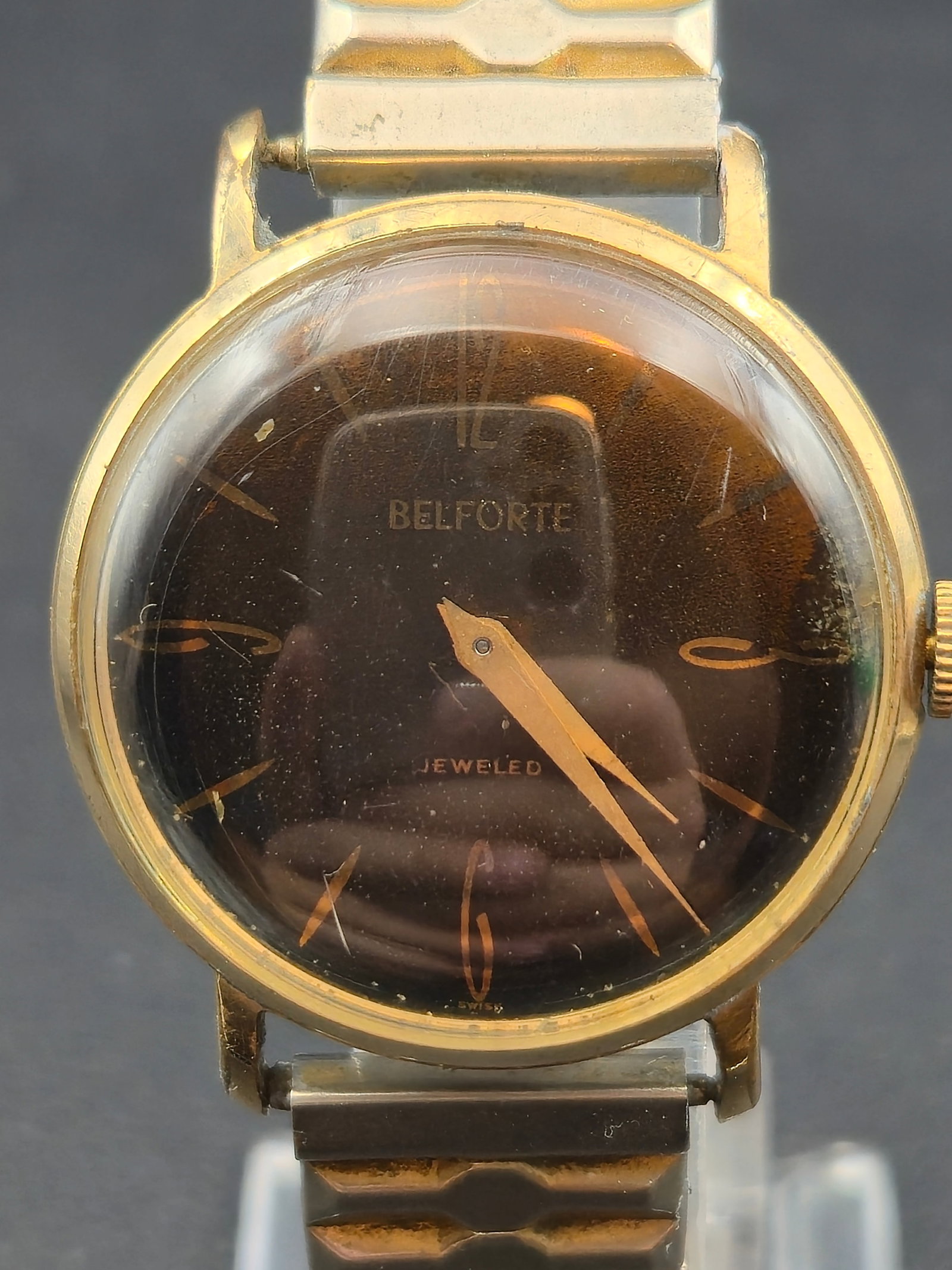 1950s Belforte Model 11C2 17J Swiss Manual Watch 33mm Gold Tone Case Stainless Back Brown Dial Runni: Vintage mid century Belforte Swiss wristwatch powered by a manual wind Model 11C2 movement with seventeen jewels. The watch features a brown dial with stylized Arabic numerals at 12, 3, 6, and 9 with 