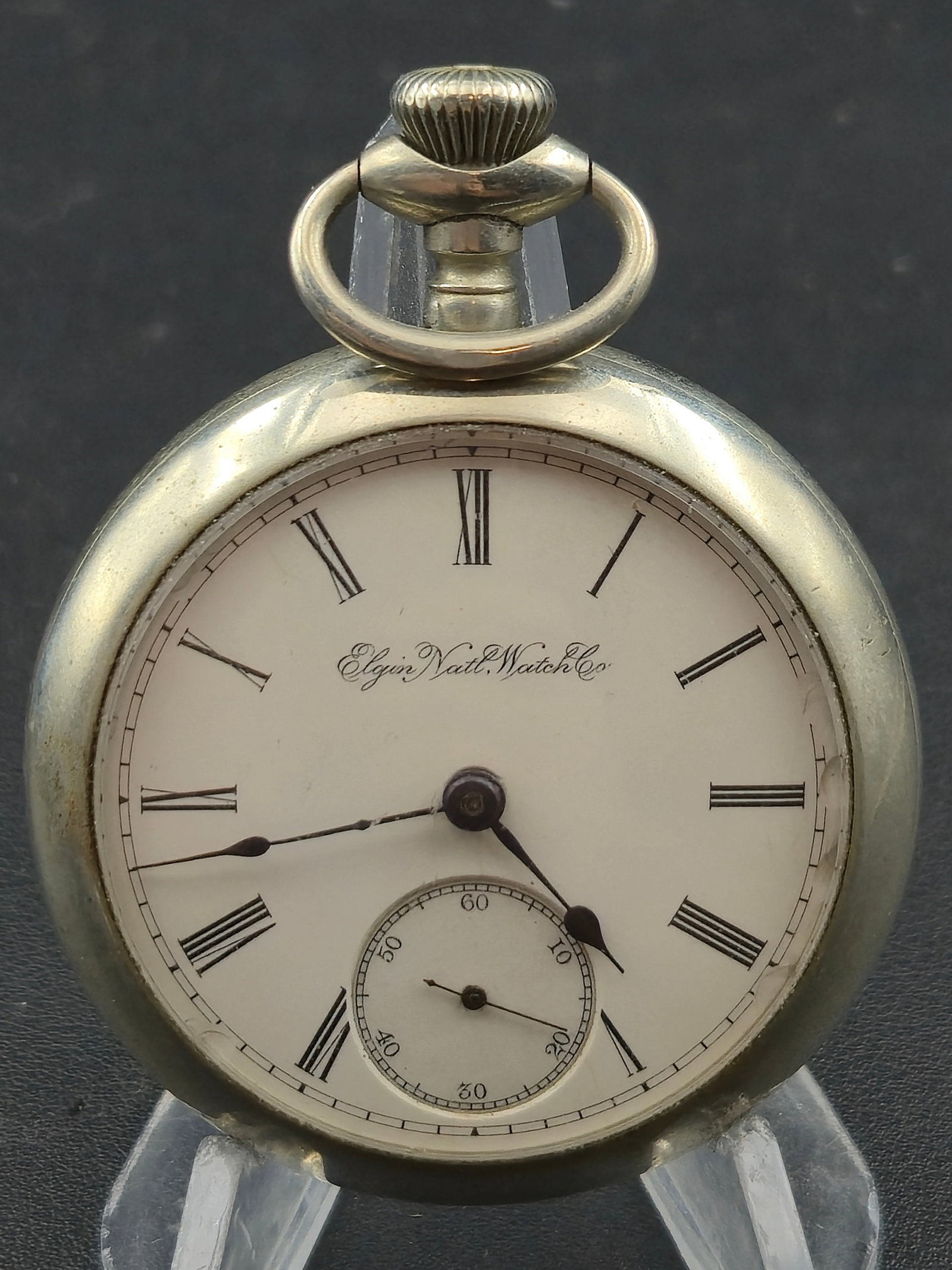 1907 Elgin Grade 294 Model 5 18s 7J Pocket Watch Serial 12522359 Silveroid Case Running: Antique American pocket watch produced by Elgin National Watch Company around 1907. The movement serial number 12522359 corresponds to Grade 294, Model 5, an 18-size 7 jewel movement according to Elgi