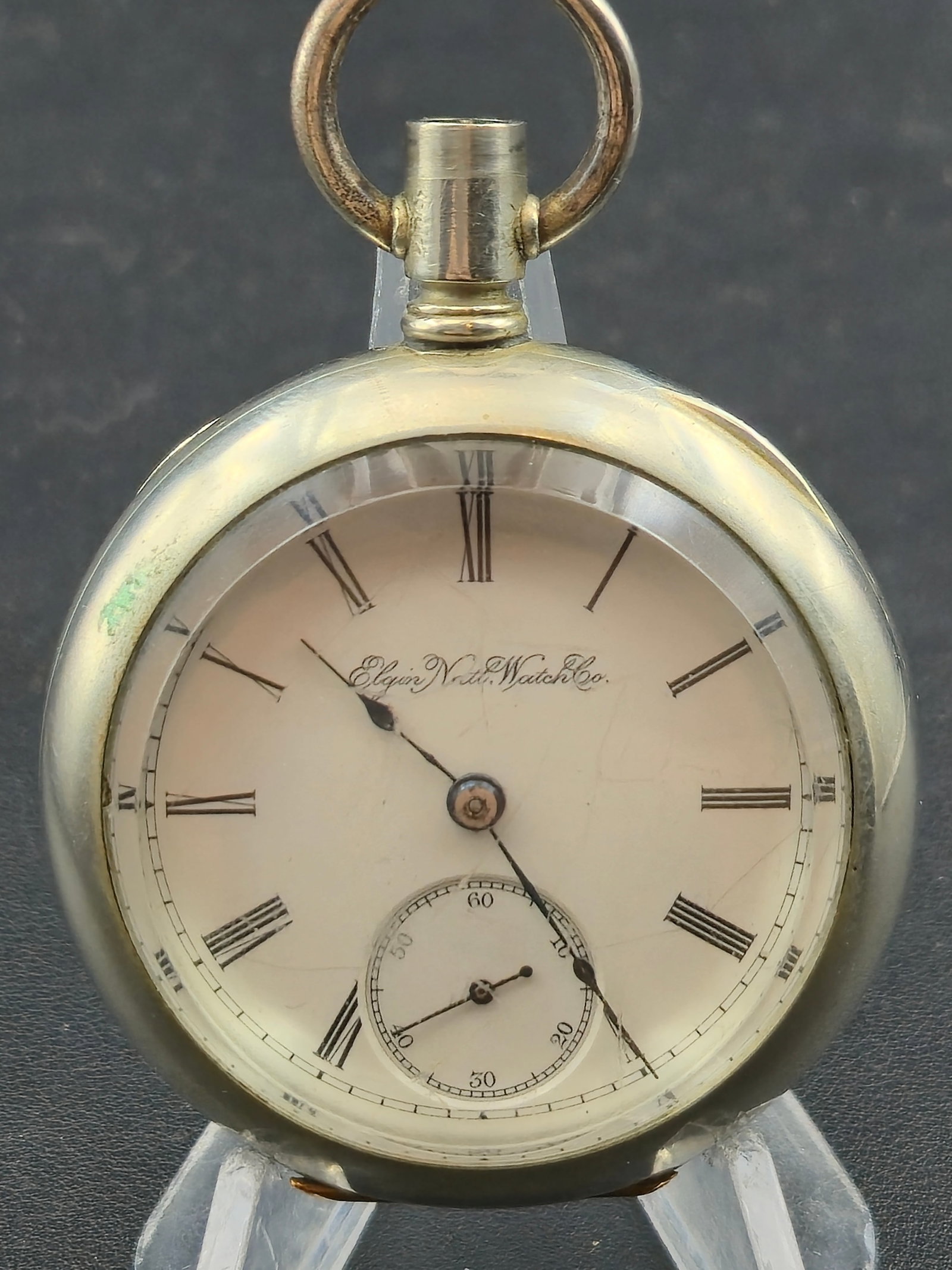 1891 Elgin Grade 73 Model 5 18s 7J Pocket Watch Trolley Tram Case Silveroid Needs Crown Stem: Antique American pocket watch produced by the Elgin National Watch Company around 1891. The movement serial number 4186211 corresponds to Elgin Grade 73 Model 5 according to the Pocket Watch Database.