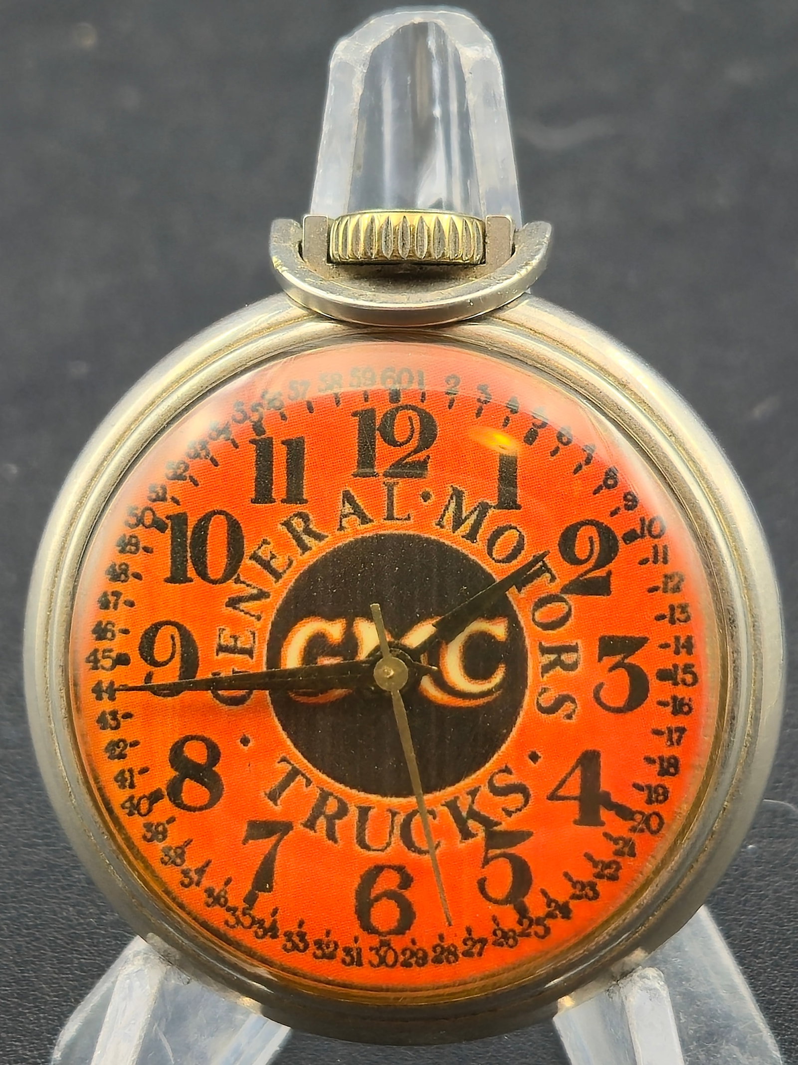 General Motors GMC Trucks Advertising Pocket Watch c1930s 50mm Running: Vintage advertising pocket watch featuring a bold General Motors GMC Trucks dial in bright orange and black with inner minute track and large Arabic numerals. The movement is a simple Swiss-style mech
