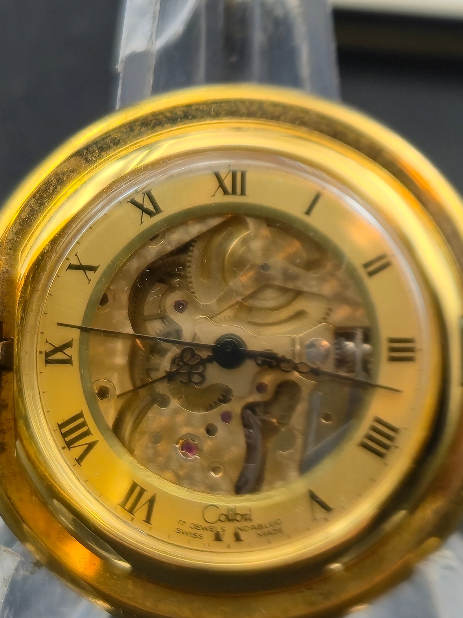 Colibri 17 Jewel Swiss Skeleton Pocket Watch 42mm w Box Papers Receipt Runs: Vintage Colibri skeleton pocket watch featuring a visible mechanical movement through the dial with Roman numeral chapter ring. The movement is marked 17 jewels Swiss, and the inner caseback is stampe