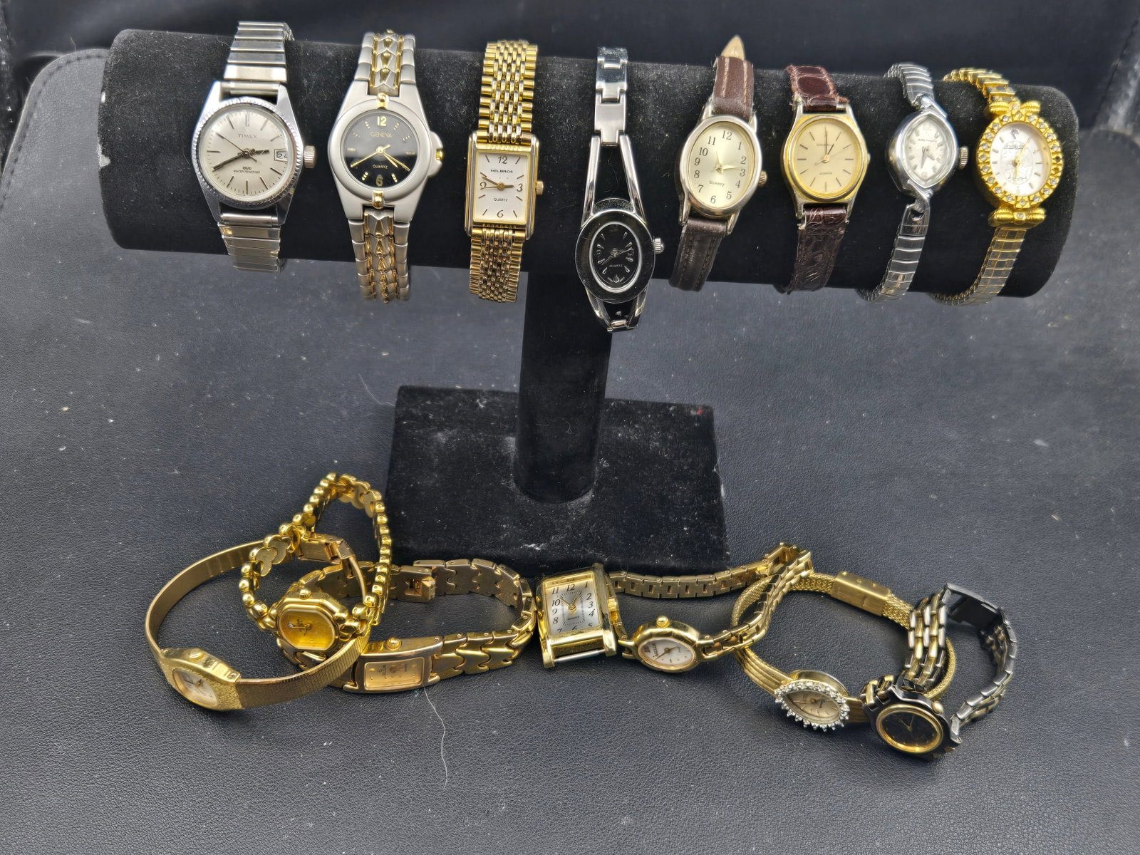 Timex Geneva Helbros Caravelle Ladies Watch Lot Gold Tone Quartz Dress 1990s: Mixed lot of ladies quartz wristwatches featuring Timex, Geneva, Helbros, and Caravelle examples with strong gold tone dress styling. This group includes a variety of bracelet and leather strap design