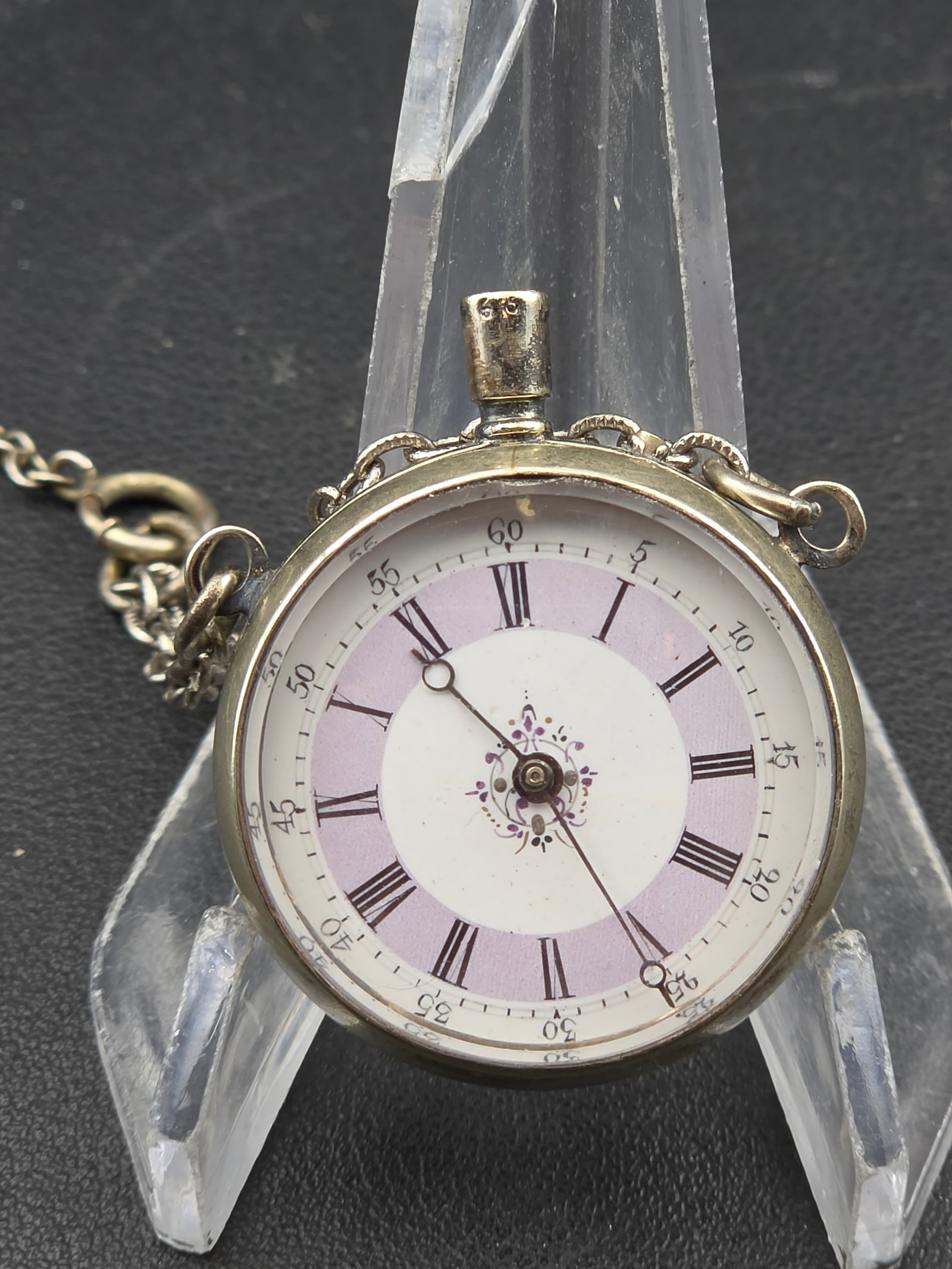 Antique Swiss Ladies Pendant Watch Guilloche Enamel Dial Display Back w Chain c1900s: Antique Swiss ladies pendant watch featuring a guilloche enamel dial with lavender chapter ring and floral center motif. Roman numerals with outer minute track. Display back reveals the mechanical mov