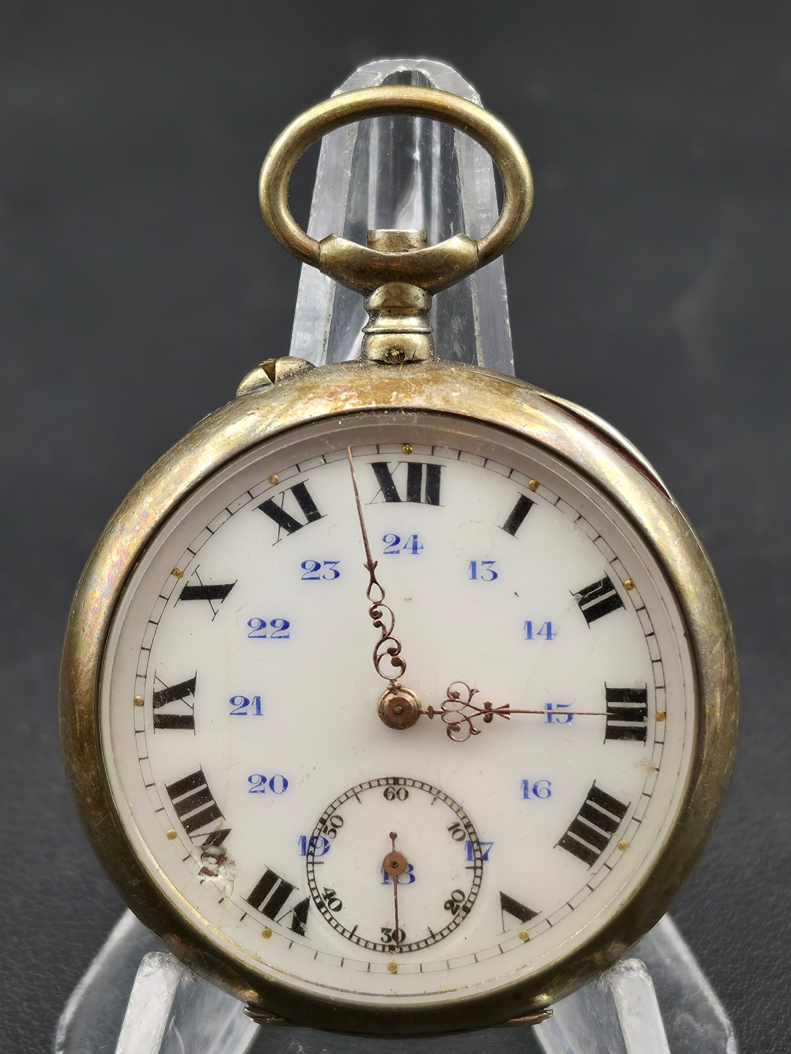 Antique Swiss Pocket Watch 24 Hour Dial Enamel Roman Numerals Ornate Hands 47mm Case: Antique Swiss pocket watch featuring a white enamel dial with Roman numerals and inner 24-hour blue track. Ornate filigree-style hands and sub-seconds at 6. Case shows age with warm patina and surface