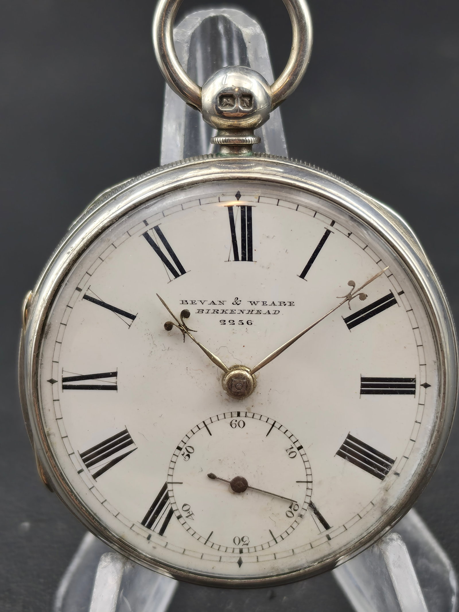 Bevan & Weare Birkenhead 9256 Silver Pocket Watch Runs 51mm Key Wind Antique English Dial: Antique Bevan & Weare pocket watch signed Birkenhead 9256 on the dial, housed in a silver case with English hallmarks visible inside the caseback. The watch is currently running.Features a clean white