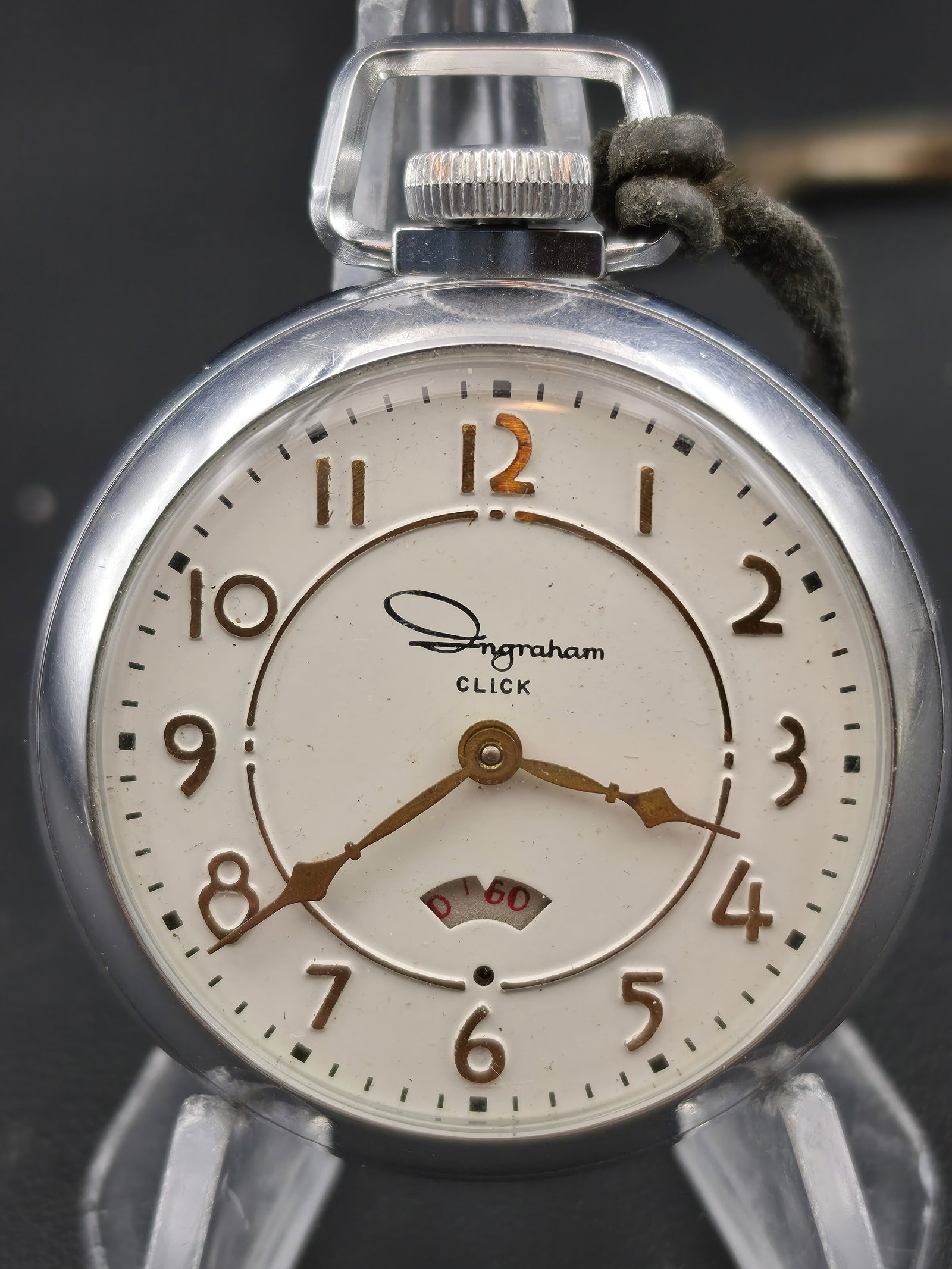 Ingraham Click Pocket Watch Chrome Plated 50mm Power Reserve Style Running Vintage: Vintage Ingraham “Click” pocket watch featuring power reserve style indicator at 6 o’clock and stylized Arabic numerals. Chrome plated brass case with visible wear and scratching. Caseback m