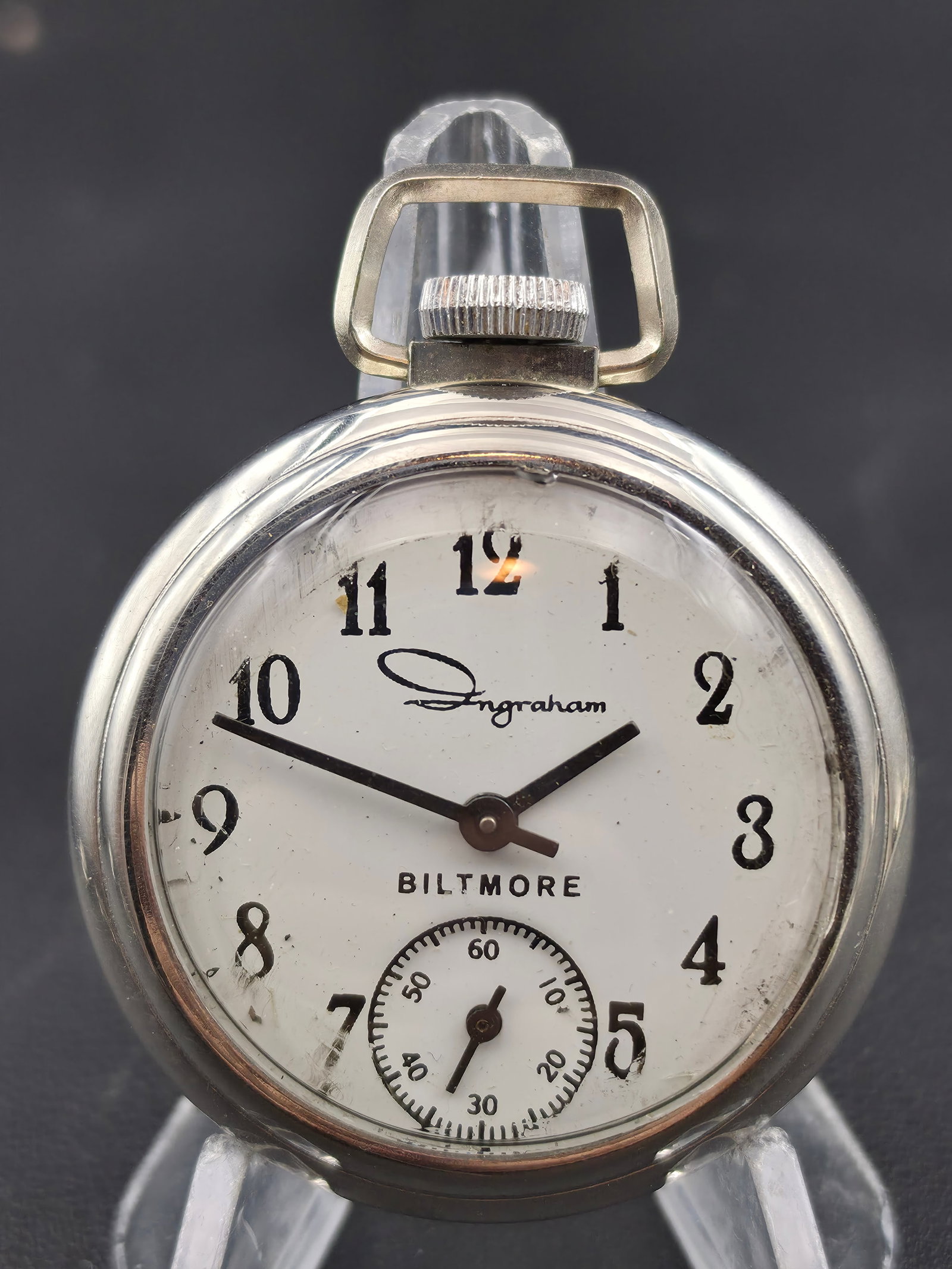 Ingraham Biltmore Pocket Watch c.1950s 50mm Chrome Plated Running: Vintage Ingraham “Biltmore” pocket watch with sub-seconds at 6 o’clock and stylized Arabic numerals. Chrome plated brass case shows moderate surface wear and scratching. Movement signed Ingr