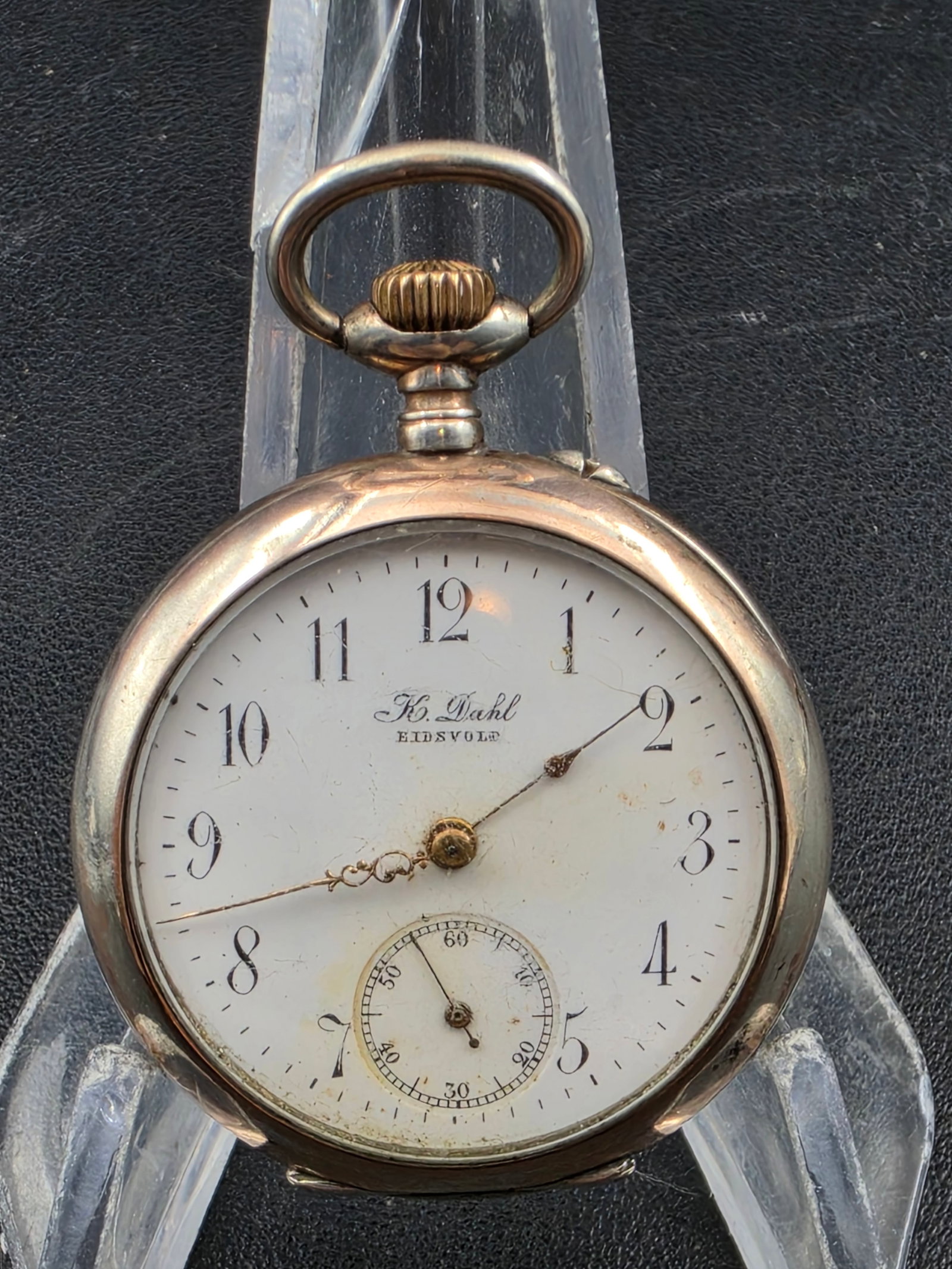 Early 1900s K Dahl Eidsvold Swiss Cylindre Pocket Watch 10 Rubis Hunter Case 36mm: Vintage Swiss pocket watch signed “K. Dahl Eidsvold” on the dial, featuring a Cylindre 10 Rubis movement as marked inside the case. Classic enamel dial with ornate hands and subsidiary seconds