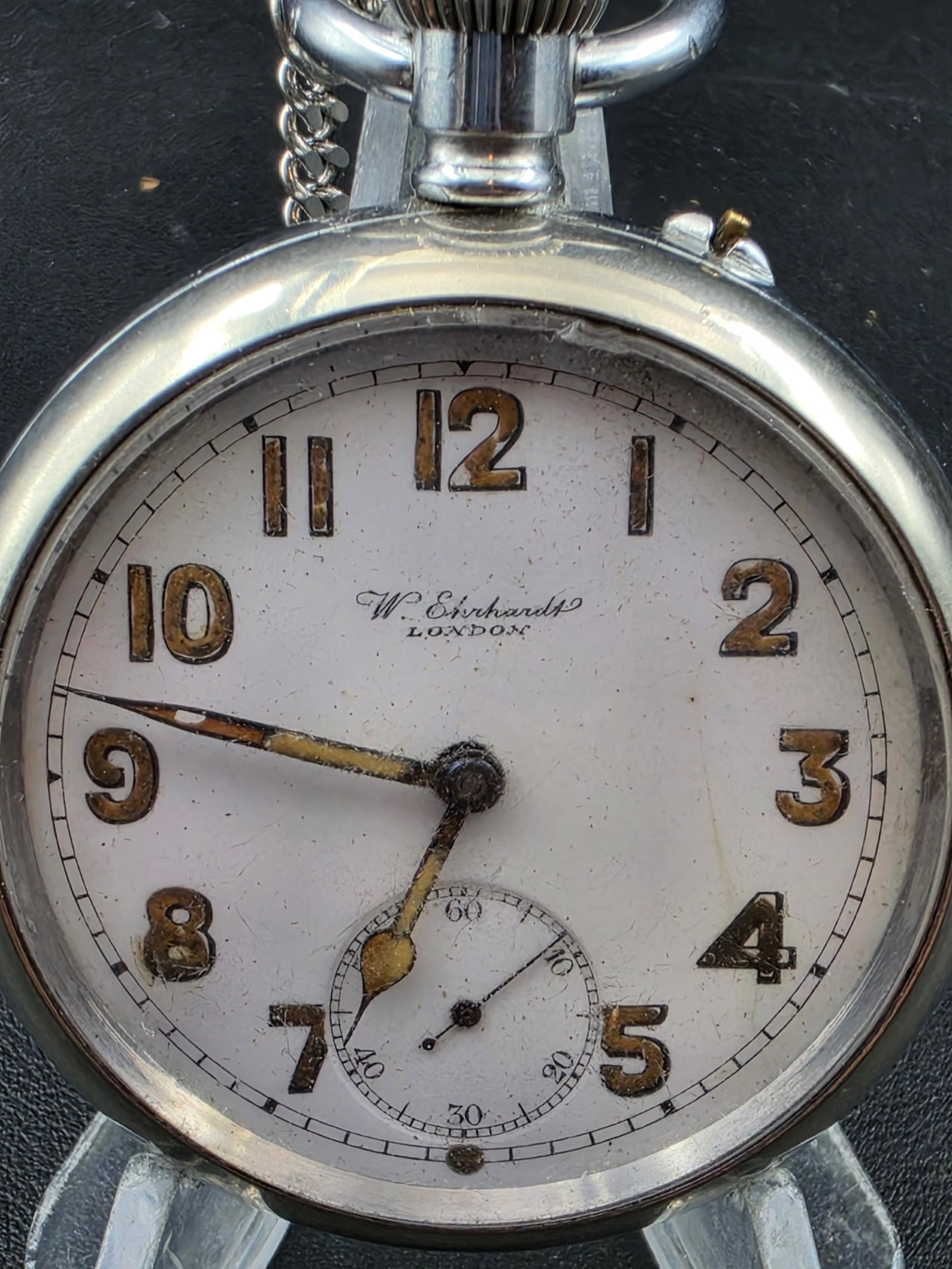 Antique W. Everhardt Oxford Pocket Watch 52mm Swiss Sub Seconds Engraved Case Running: Antique W. Everhardt Oxford pocket watch featuring a large 52mm case with engraved exterior. White enamel dial signed “W. Everhardt Oxford” with Arabic numerals and sub-seconds at 6. Dial show