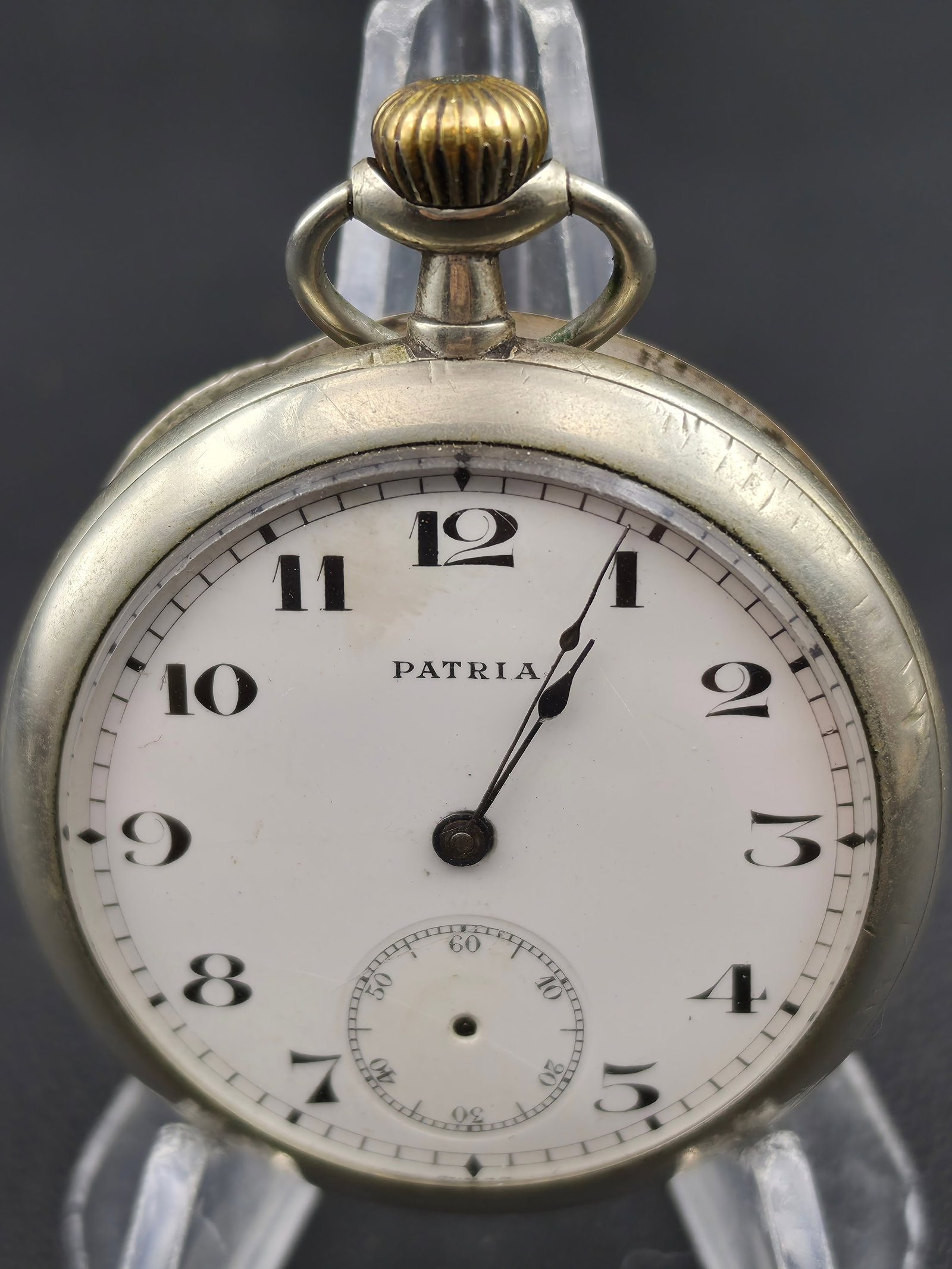 Patria Swiss Pocket Watch 50mm White Dial Sub Seconds c1920s Nickel Case Untested: Vintage Swiss “Patria” pocket watch featuring a clean white enamel dial with Arabic numerals and sub-seconds at 6. Likely dating to the early 20th century (circa 1920s), this piece is housed i