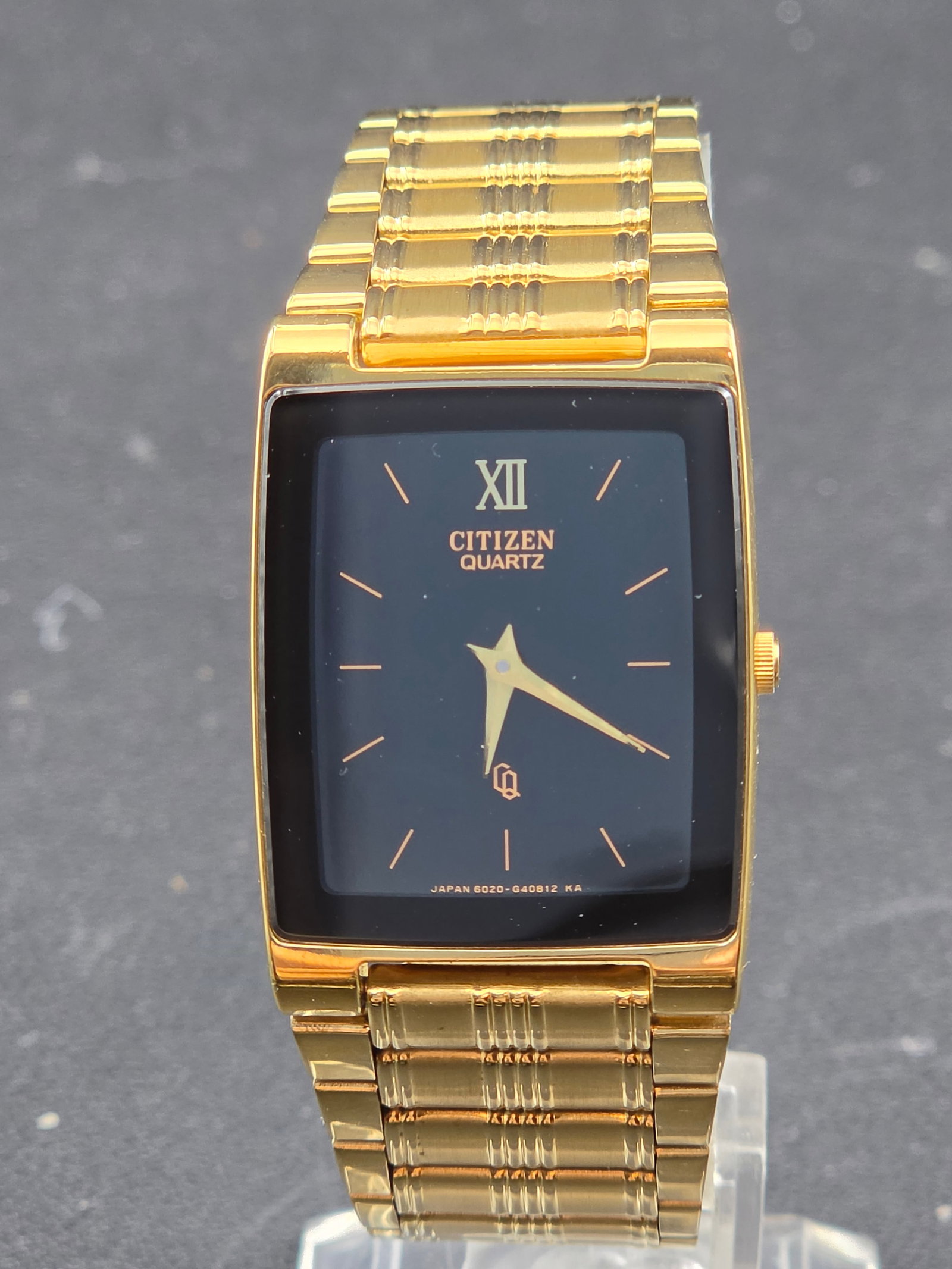 1994 Citizen Quartz 6020-G40812 KA 1022-H14291 HSB 25mm Gold Tone Tank Watch New Battery: Citizen quartz rectangular tank-style wristwatch, produced approximately November 1994 based on the 4N serial format, with dial reference 6020-G40812 KA and caseback reference 1022-H14291 HSB. The dia