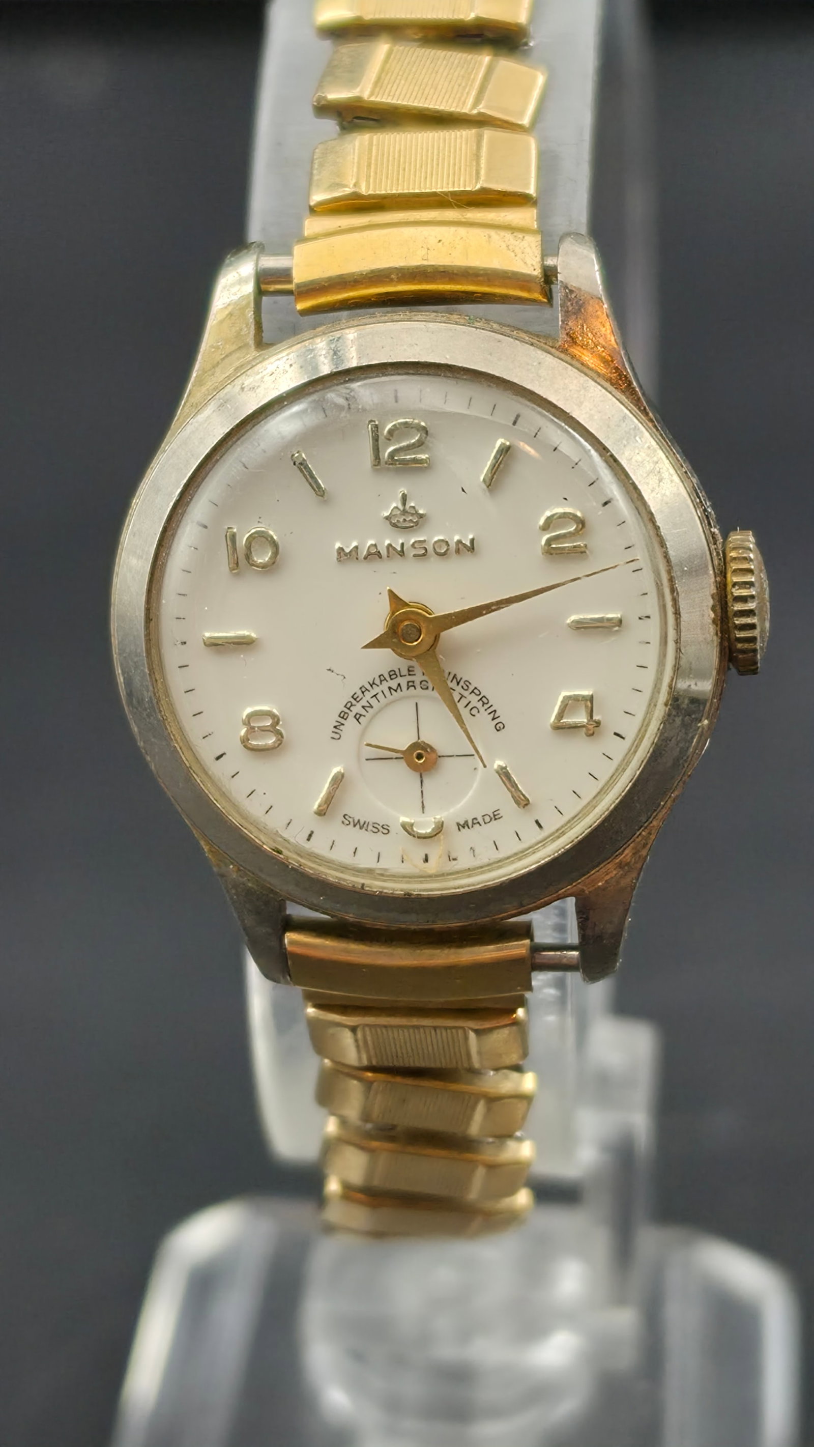 Manson Swiss Mechanical Watch 25mm Gold Tone Antimagnetic Runs Vintage Dress: Vintage Manson Swiss mechanical wristwatch featuring a classic cream dial with applied gold-tone Arabic numerals and small seconds subdial. Dial marked “Unbreakable Mainspring Antimagnetic” an