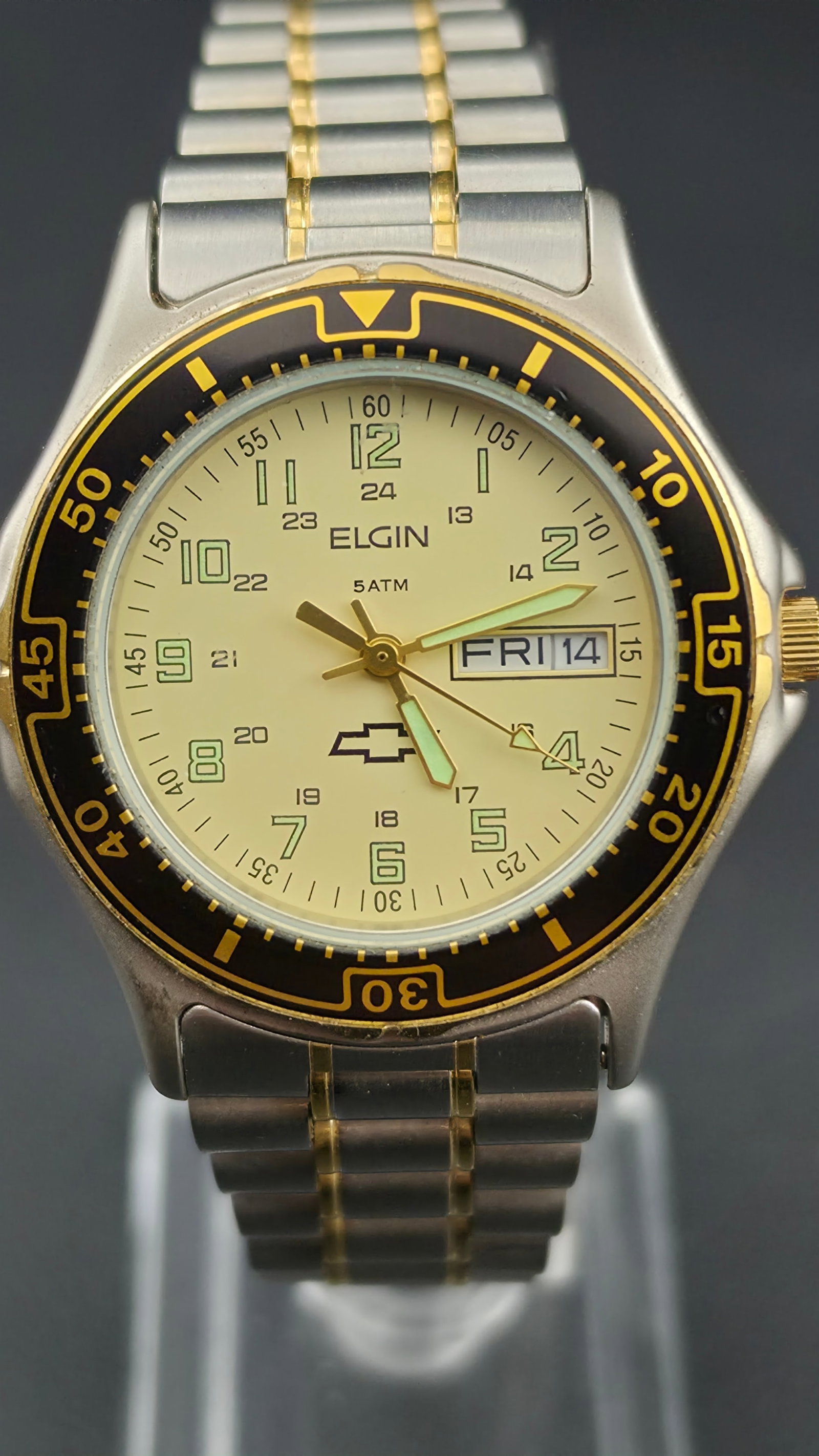 Elgin Limited Edition Chevrolet Logo Watch - Two-Tone Gold & Steel - 37mm Running New Battery - Dive: Conversation with GeminiIdentify and create listing for an auction site include title up to a hundred and twenty characters and a descriptionThis is a fascinating piece of pop-culture horology. This i