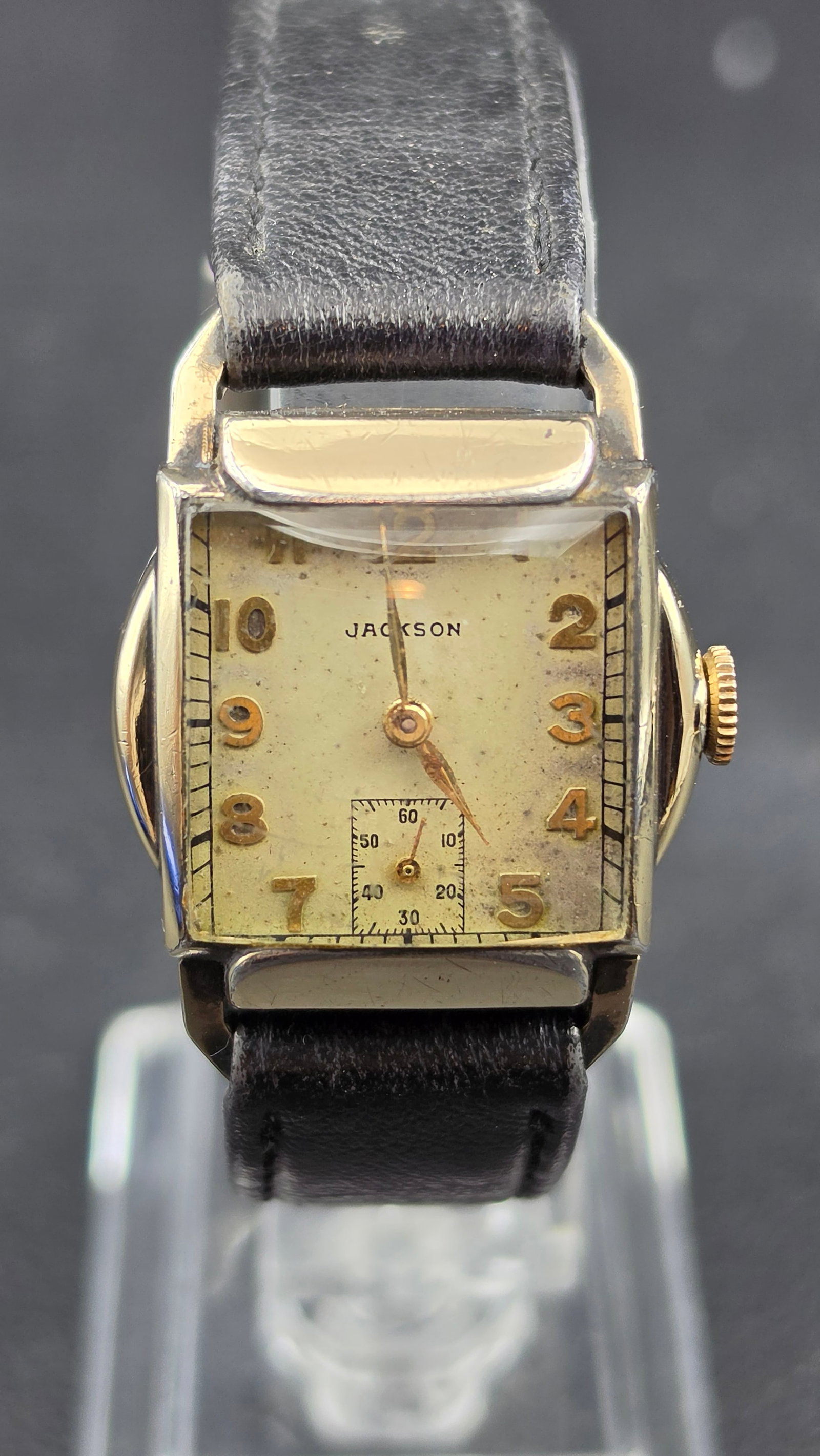 1940s-1950s Jackson 15J Swiss Unadjusted Tank 25mm Gold Tone Two-Tone Case: This is a Jackson-branded Swiss-made dress watch from the late 1940s to early 1950s, measuring 25.31mm across the case as confirmed by calipers. The movement is marked "Maya Watch Co. / Fifteen 15 Jew