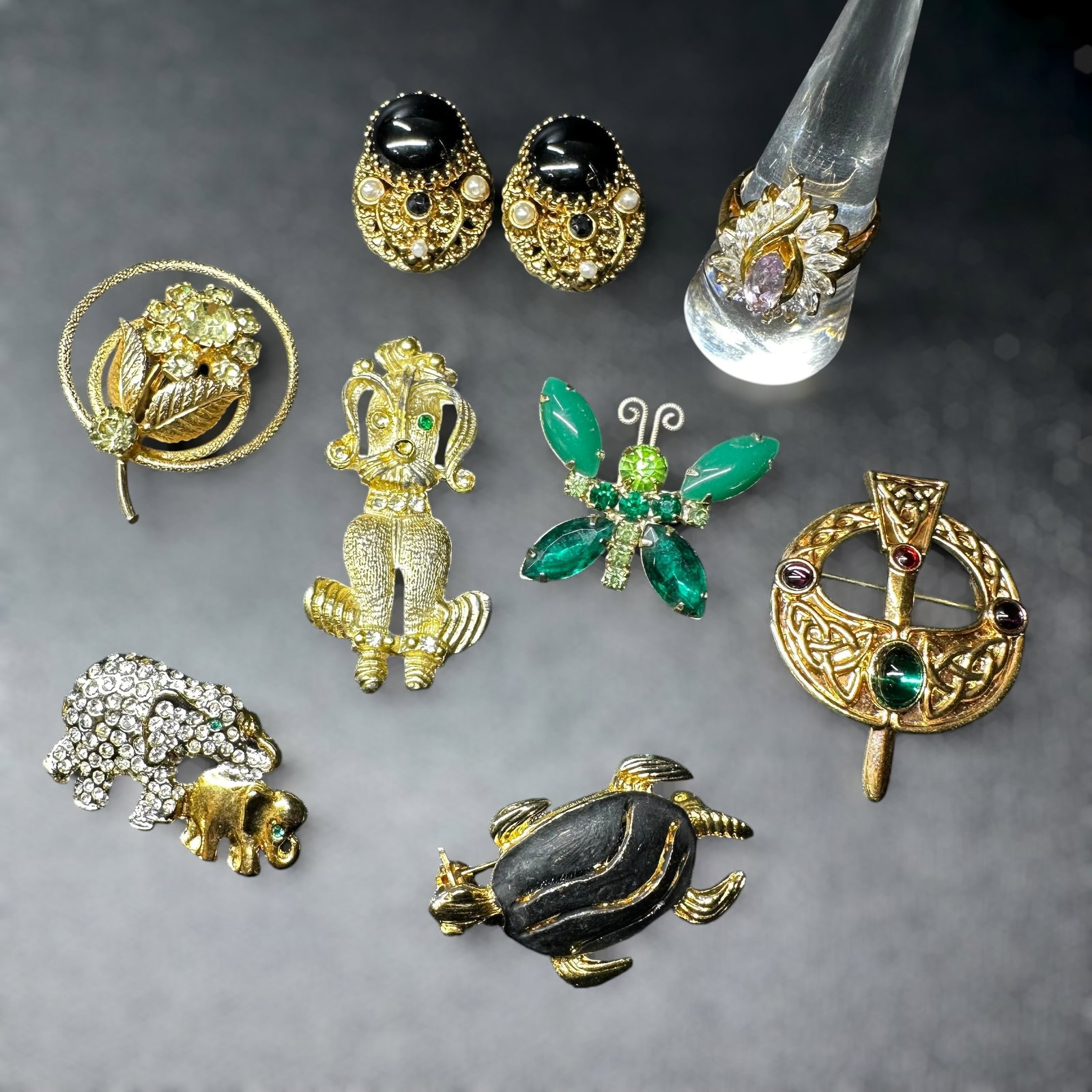 83g Vintage Gold Tone Faceted Rhinestone Ring, Brooch & Earrings Lot: 83g Vintage Gold Tone Ring, Brooch & Earrings Lot:Brand/Model: Mixed; includes “West Germany” marked earrings; others unmarked.Manufacturer Location: Germany (earrings); others not marked.Year