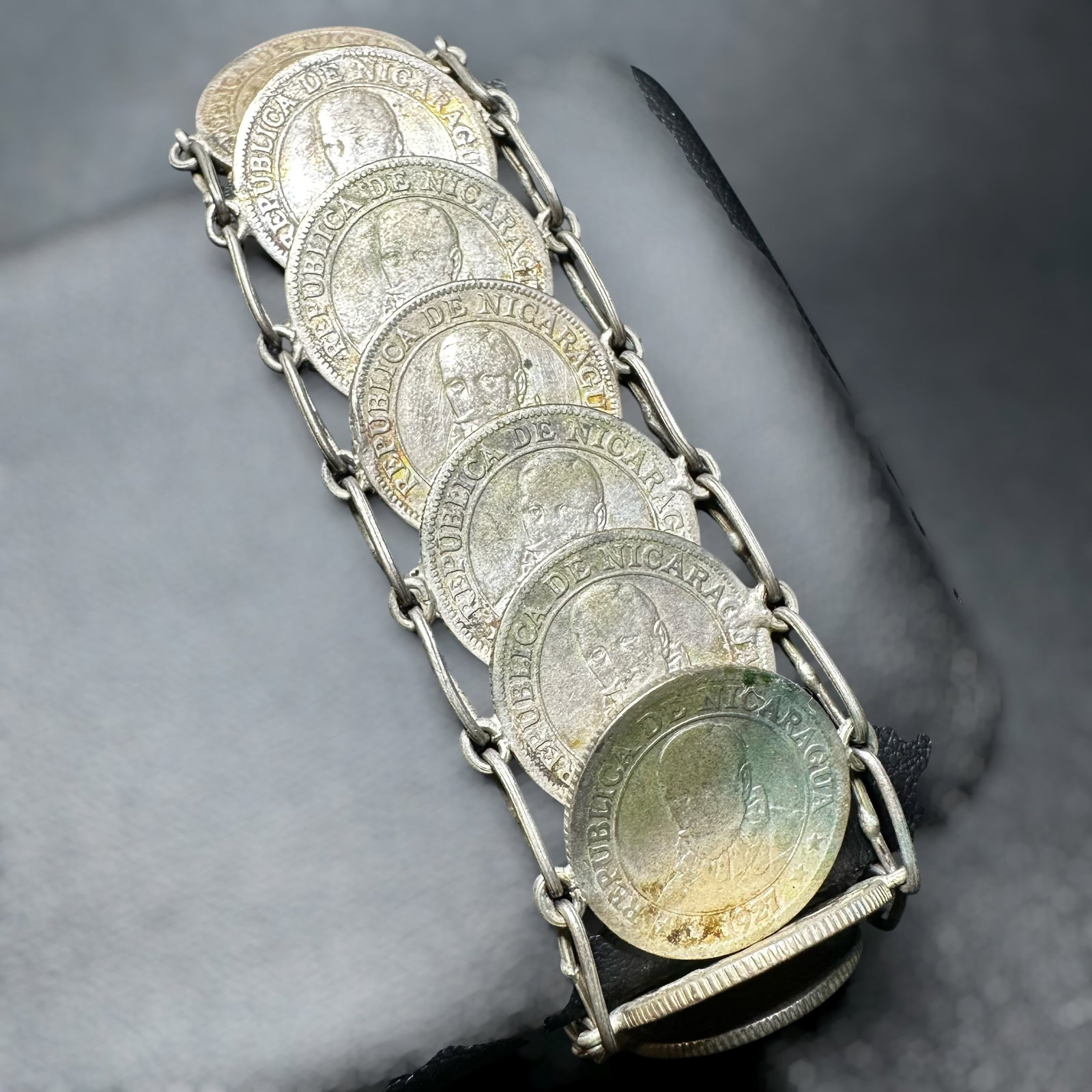 7”/46g Antique Nicaraguan Coin Link Bracelet: 7”/46g Antique Nicaraguan Coin Link BraceletBrand/Model: No hallmark.Manufacturer Location: Nicaragua (coins).Year Produced: 1928.Condition: Good condition with surface wear, oxidation, and pati