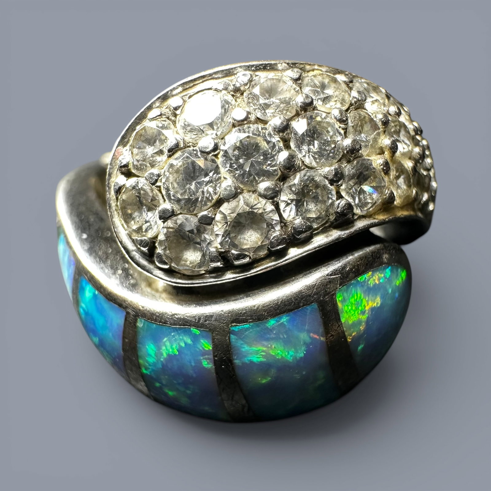 Sz9/Adjustable/10g 925 Sterling Silver Opal & Cubic Zirconia Ring: Sz9/Adjustable/10g 925 Sterling Silver Opal & Cubic Zirconia Ring:Brand/Model: Hallmarked “925” and “CHINA.”Manufacturer Location: China.Year Produced: Unknown.Condition: Good conditio