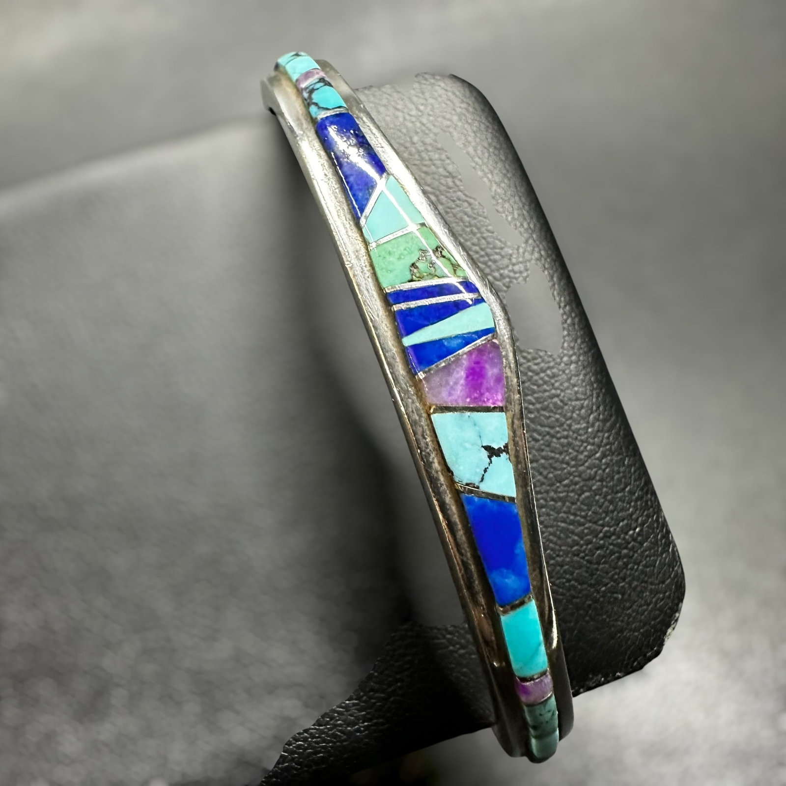 7”/22g Navajo Calvin Begay Multi-Stone Sterling Silver Inlay Cuff: 7”/22g Navajo Calvin Begay Multi-Stone Sterling Silver Inlay CuffBrand/Model: Hallmarked “Calvin TSF Begay.” Calvin Begay Sterling Silver Mixed Gemstone Inlay Open Calvin Begay is a reno