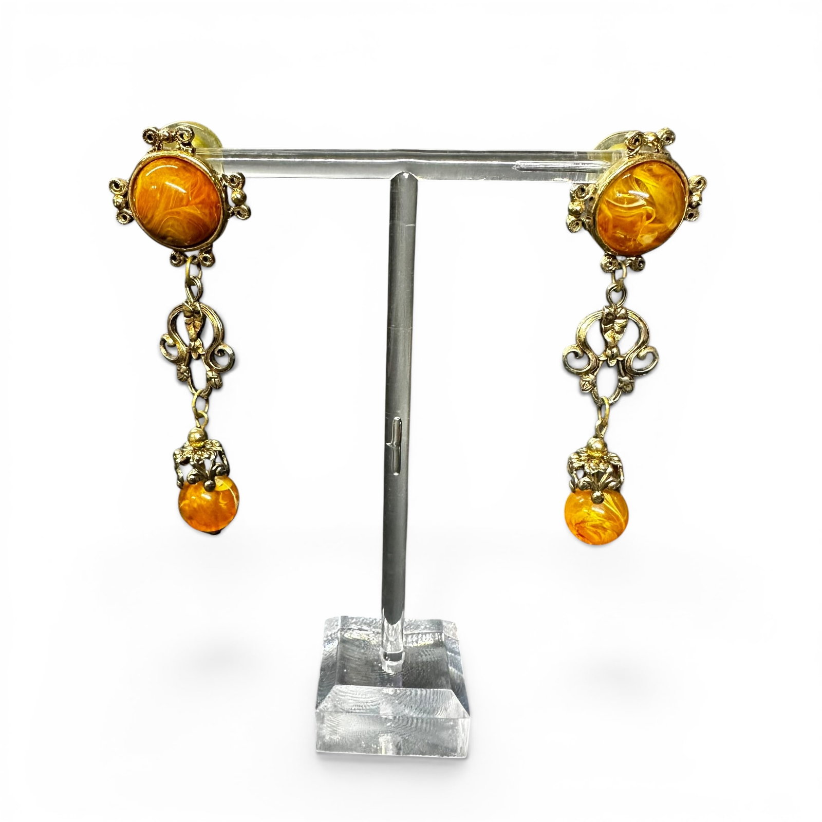 18g Vintage Marbled Orange Resin Gold Tone Dangle Earrings: 18g Vintage Marbled Orange Resin Gold Tone Dangle EarringsBrand/Model: No hallmark.Manufacturer Location: Not marked.Year Produced: Unknown; likely late 20th century.Condition: Overall good vintage co