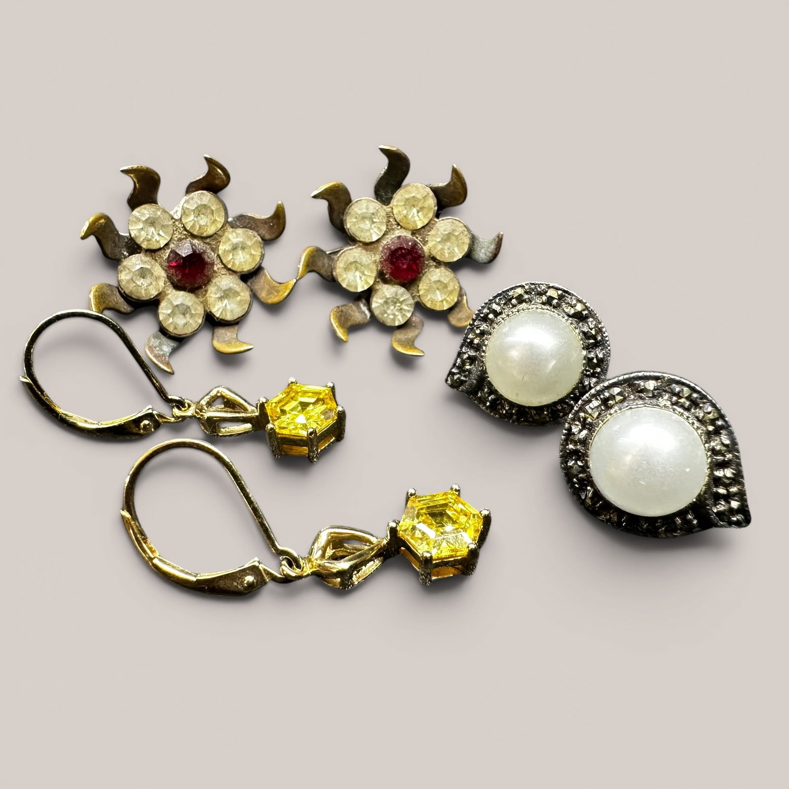 12g Faceted Yellow Stone China 925 Sterling Silver Mixed Earrings Lot: 12g Faceted Yellow Stone China 925 Sterling Silver Mixed Earrings Lot:Brand/Model: No hallmark; mixed styles.Manufacturer Location: Not marked.Year Produced: Unknown; mixed eras.Condition: Overall goo