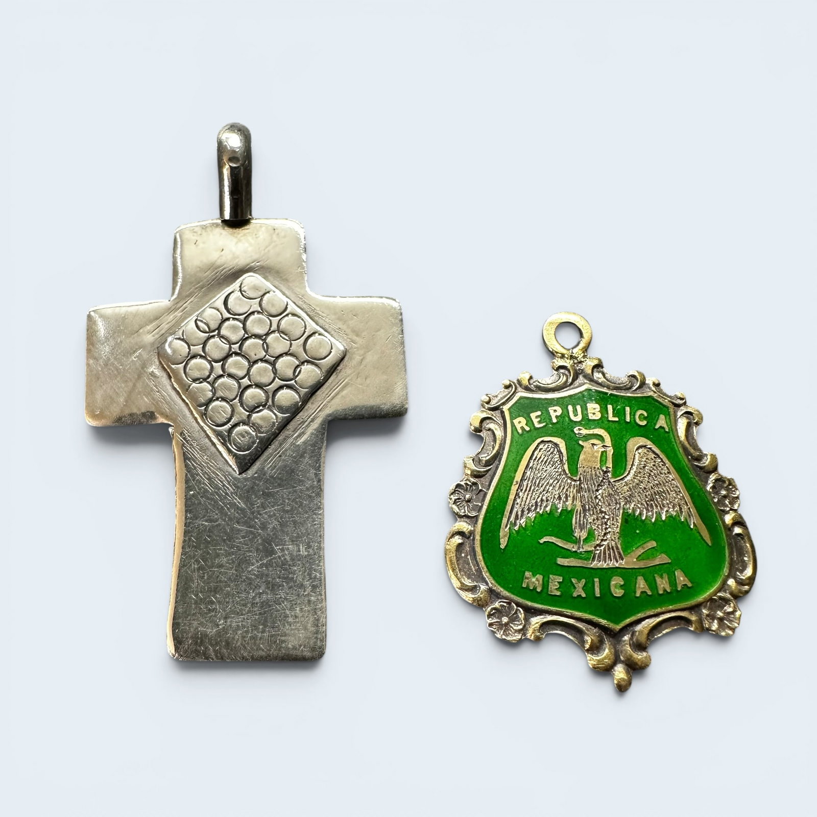 10g 925 Sterling Silver Cross & Republica Mexicana Pendant Lot: 10g 925 Sterling Silver Cross & Republica Mexicana Pendant Lot:Brand/Model: Cross pendant hallmarked “602 by Jofre”; enamel charm marked “CED STERLING.”Manufacturer Location: Republica