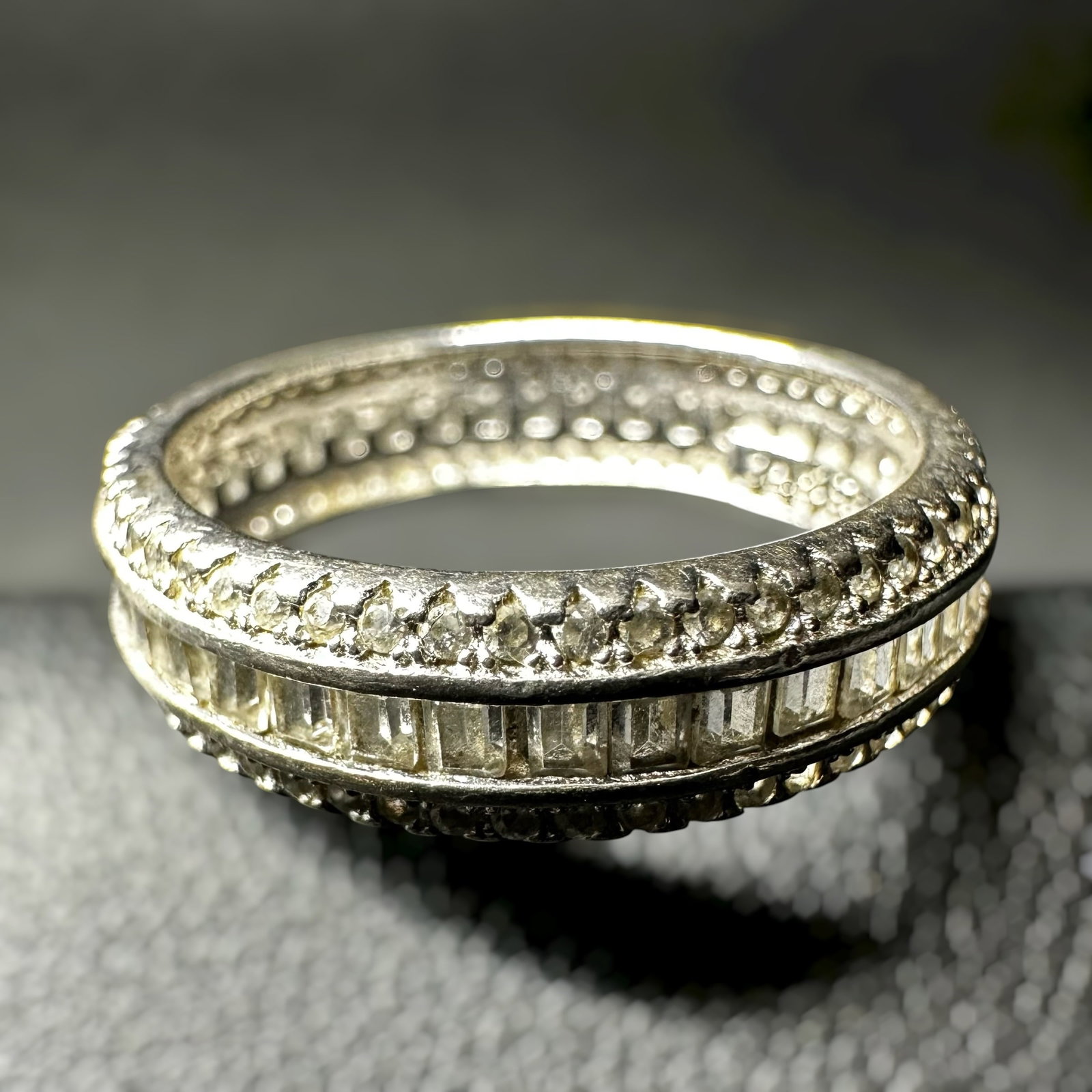 Sz7.75/3g 925 Sterling Silver Cubic Zirconia Eternity Band Ring: Sz7.75/3g 925 Sterling Silver Cubic Zirconia Eternity Band Ring:Brand/Model: Hallmarked “YGI 925 CHINA.”Manufacturer Location: China.Year Produced: Unknown.Condition: Good condition with surfa