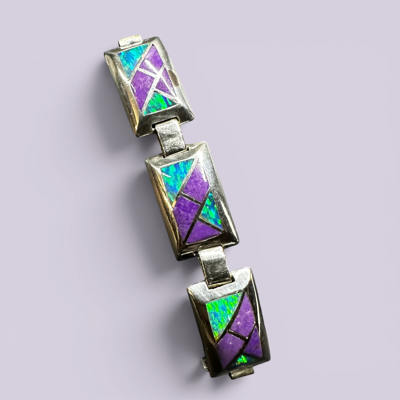 6.5”/28g Temé Sterling Silver Opal & Sugilite Inlay Link Bracelet: 6.5”/28g Temé Sterling Silver Opal & Sugilite Inlay Link Bracelet:Brand/Model: Hallmarked “Temé.” This collective brand name was established by Lional McKinney as an evolution of Sunbu