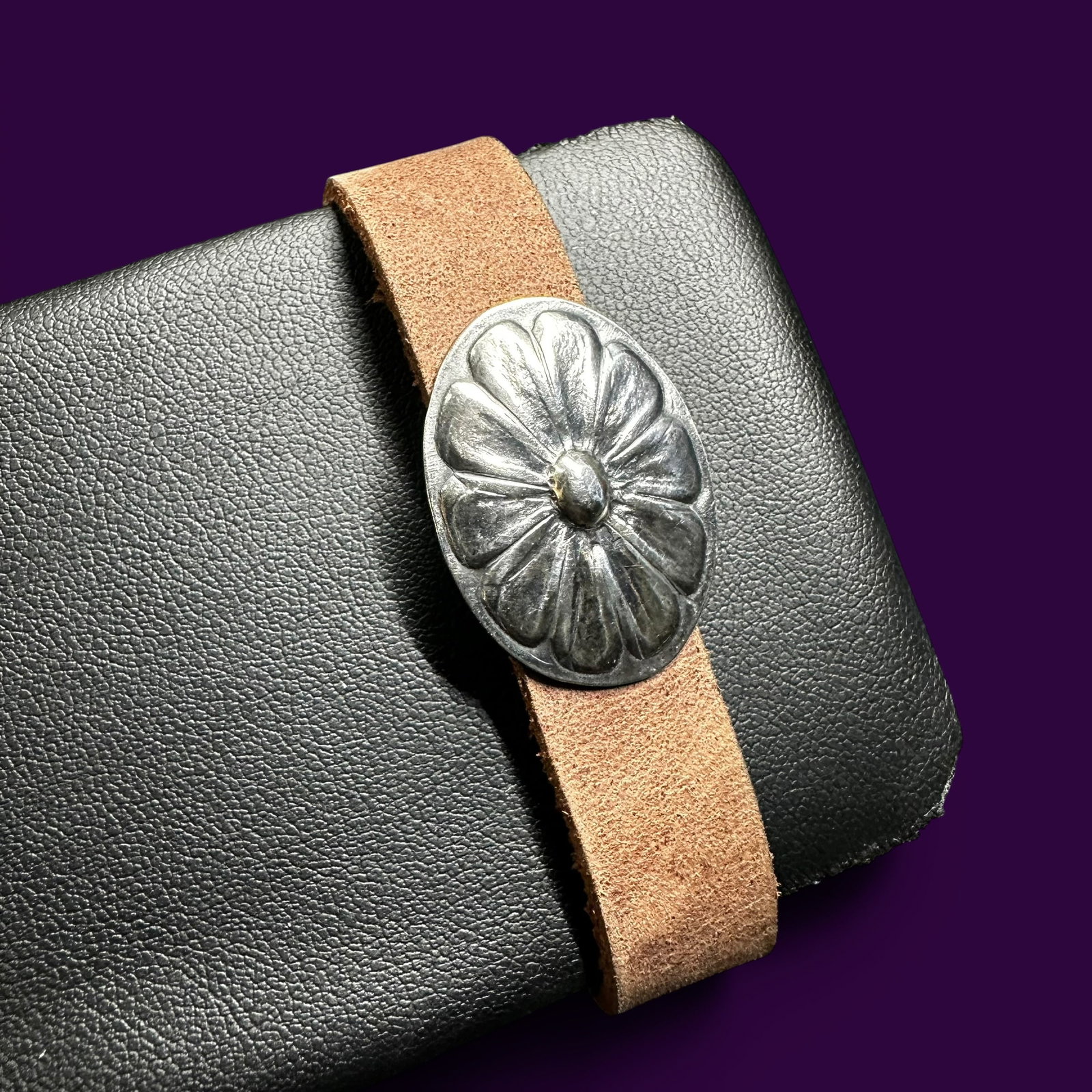 6.25-7”/14g Vintage Sterling Silver Concho Leather Bracelet: 6.25-7”/14g Vintage Sterling Silver Concho Leather BraceletBrand/Model: No hallmark.Manufacturer Location: Not marked.Year Produced: Unknown.Condition: Good condition with surface wear, patina, 