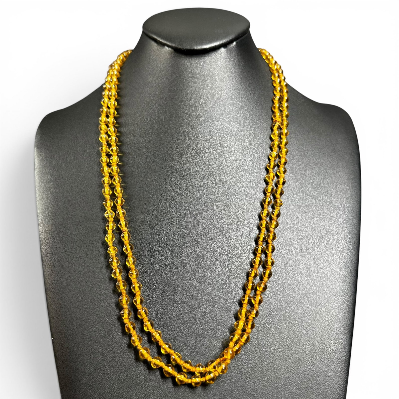 48”/32g Amber Glass Beaded Necklace: 48”/32g Amber Glass Beaded NecklaceBrand/Model: No hallmark.Manufacturer Location: Unknown.Year Produced: Unknown.Condition: Good condition with light surface wear appropriate for age and use.Sp