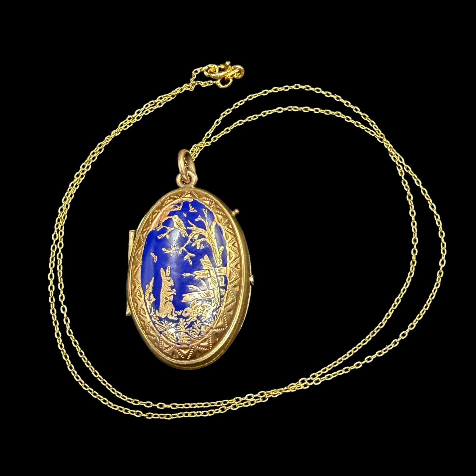 Antique Victorian Gold Tone Blue Enamel Spring Rabbit Castle Locket Necklace & Chain: Maker: Unmarked, unknown. / Material: Gold tone base metal. Likely gold plated brass. Newer chain is gold tone Sterling Silver weighing 1.03 grams. / Stone: None. One face has blue enameling. / Size: 
