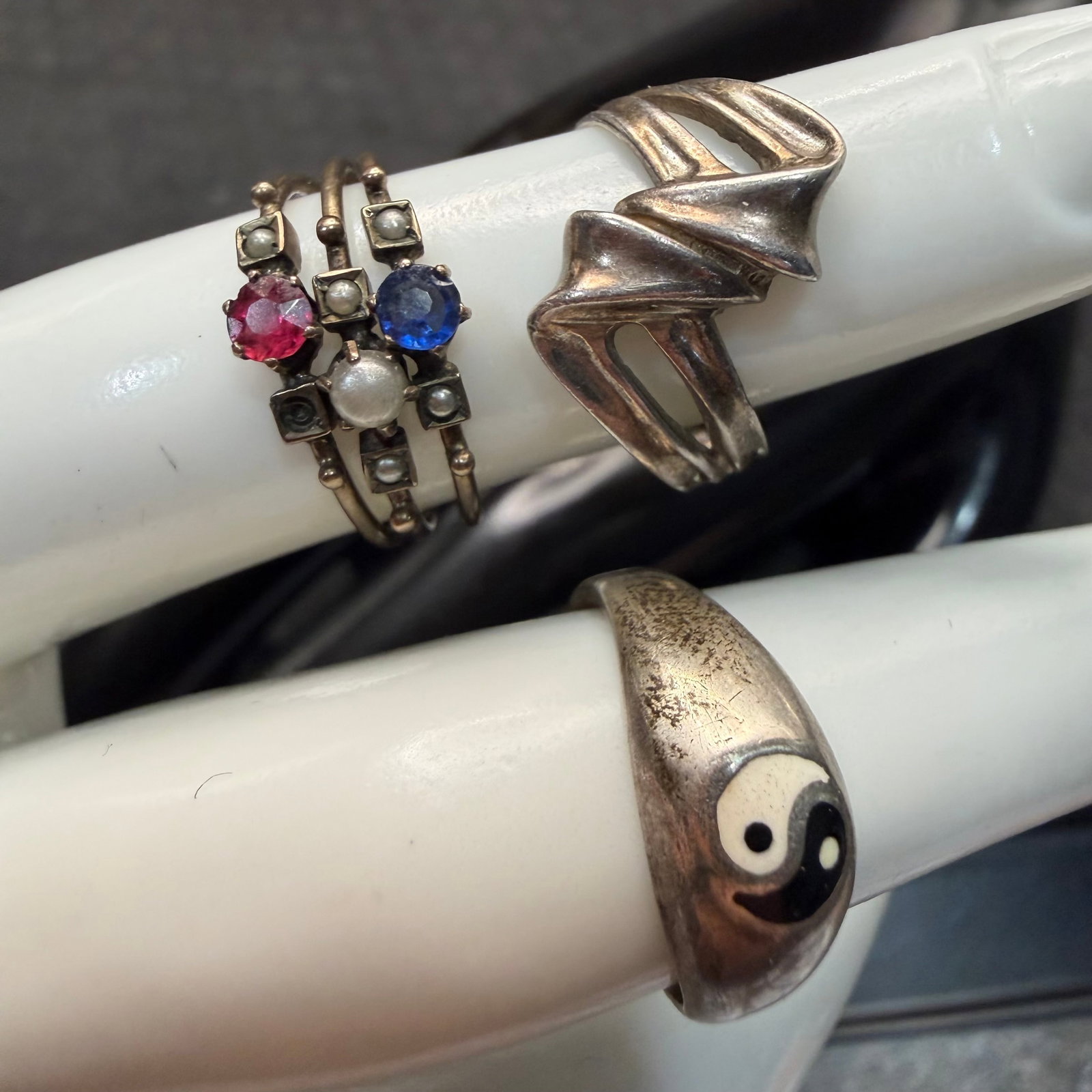 3 Vintage Sterling Silver Rings Twist Red White Blue Yin Yang Sz 5 5.25 5.28g 925: Maker: Unknown. / Material: Sterling Silver. / Size: Twist 5, RWB 5.25, Yin 5.25. / Weight: 5.28 grams combined. / Condition: Great. Ready to enjoy. Note one stone missing on side of the red white blu