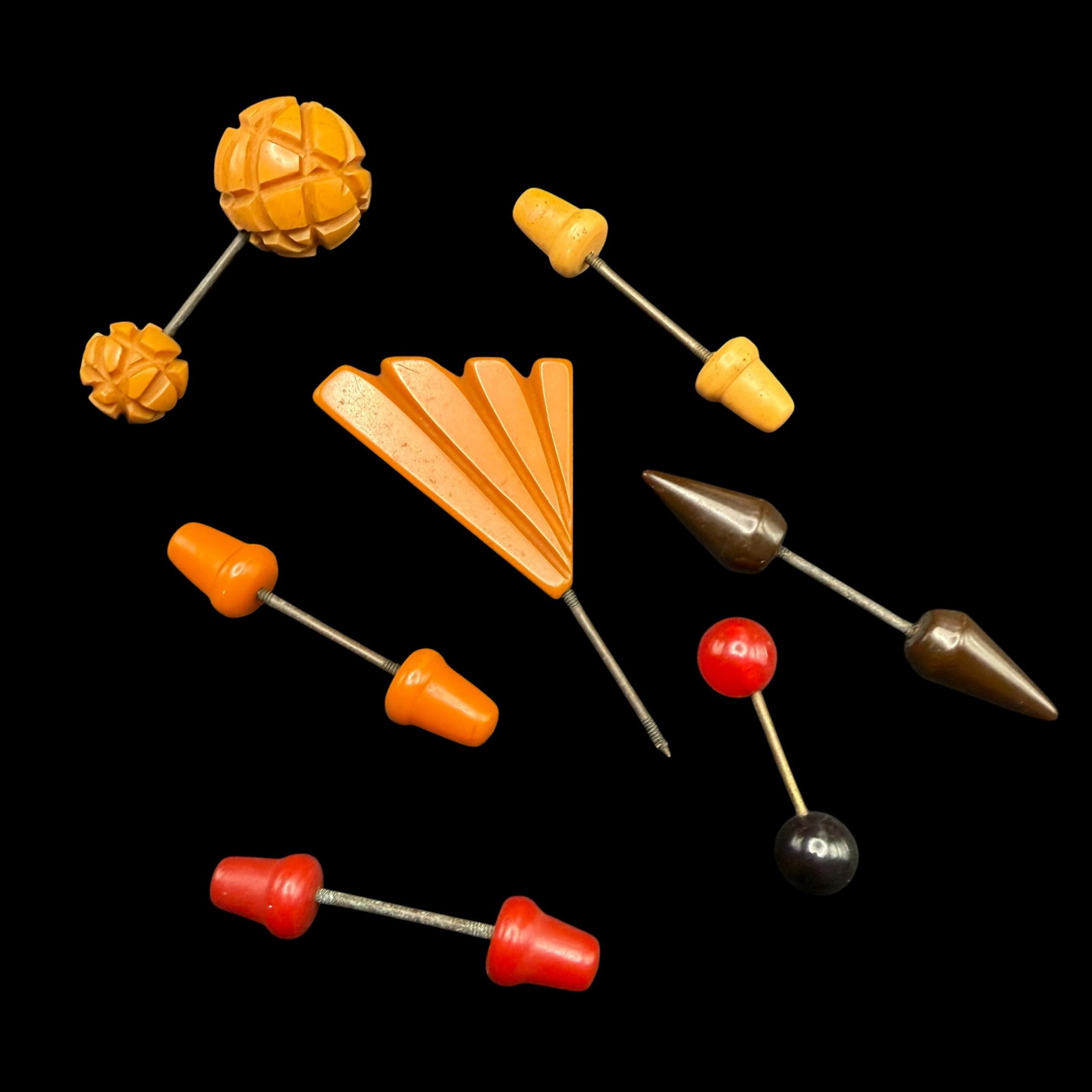 Seven Vintage Antique Bakelite Plastic Double Ended Pins 7 Butterscotch Red Black Tan Brown: Maker: Unknown. / Material: Bakelite and other plastic possibly. / Size: Range from 1 1/4” long to 2 1/8” long. The single end measures just under 2 1/2” long. / Condition: Great and