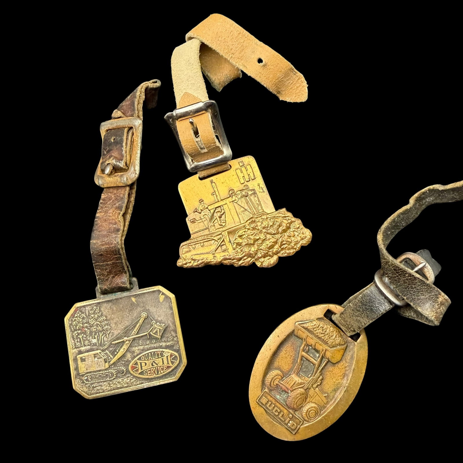3 Vintage Antique Watch Fobs P&H IH International Harvester Euclid Earth Moving Construction: Maker: P&H, International Harvester IH, Euclid. / Material: Two are brass, IH is a base metal of unknown. Condition: Great and ready to enjoy. / Sold as is. Measurements are approximate. Please see al