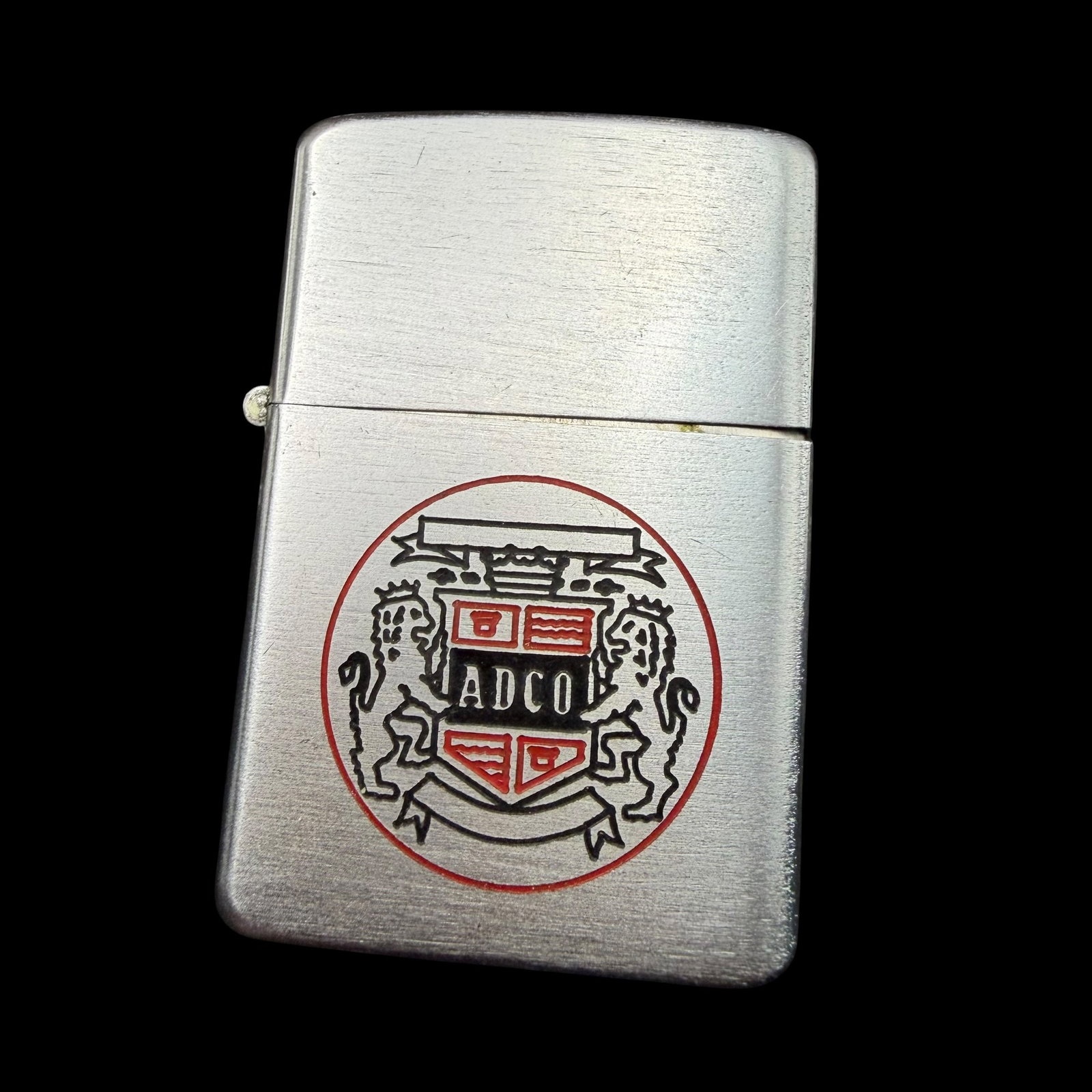 Vintage 1949 ADCO Advertising Zippo Pocket Lighter: Maker: Zippo. / Material: Brushed steel. / Size: 2 1/4” x 1 1/2” x 1/2”. / Condition: Great, ready to enjoy! Untested. / Sold as is. Measurements are approximate. Please see all phot