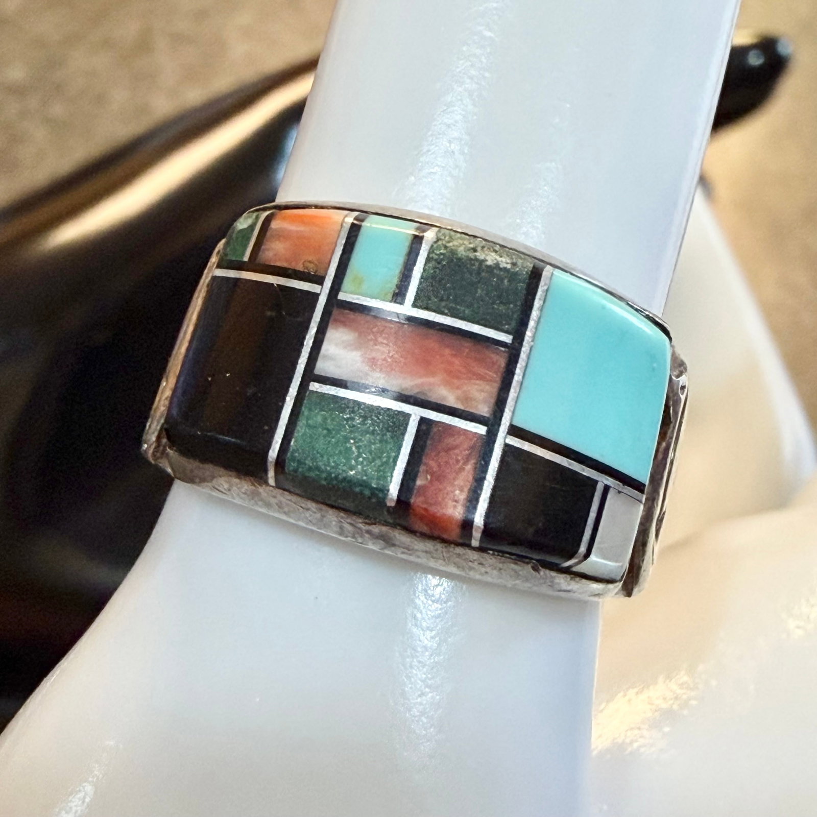 Vintage Southwestern Sterling Silver Multi Stone Inlay Band Ring Sz 8 7.90g 925 Signed: Maker: Mark shown, unknown. / Material: Sterling Silver. / Stone: Inlays of Turquoise, Black Onyx, Green Malachite, Mother of Pearl and I believe Spiny Oyster. / Size: 8. Face measures 1/2” wide