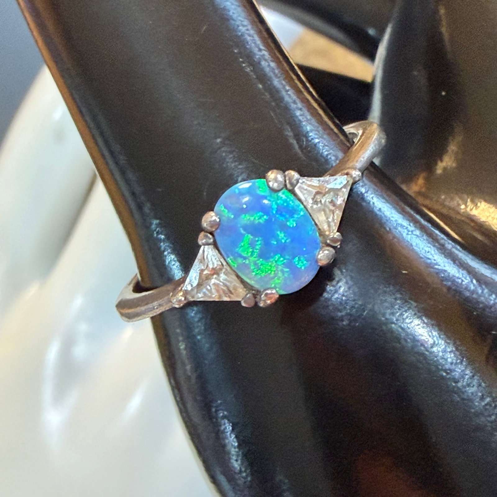 Vintage Avon Sterling Silver Opal CZ Ring Sz 11 2.97g 925: Maker: Avon. / Material: Sterling Silver. / Stone: Opal, possibly Simulated and what I believe is Cubic Zirconia on sides. / Size: 11. Face measures 5/16” wide. / Weight: 2.97 grams. / Condition
