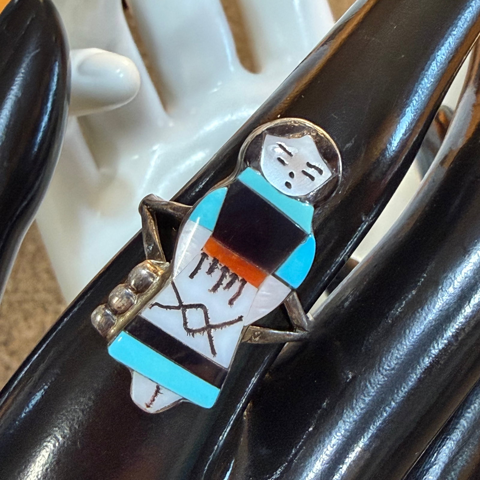 Vintage Native American Sterling Silver Girl Woman Inlay Ring Sz 9.25 4.11g 925 Theresa Waseta Zuni: Maker: Theresa Waseta, Zuni. / Material: Sterling Silver. / Stone: Inlays of Black Onyx, Turquoise, Coral and Mother of Pearl. / Size: 9.25. Face measures 1 1/8” x 1/2”. / Weight: 4.11 gra