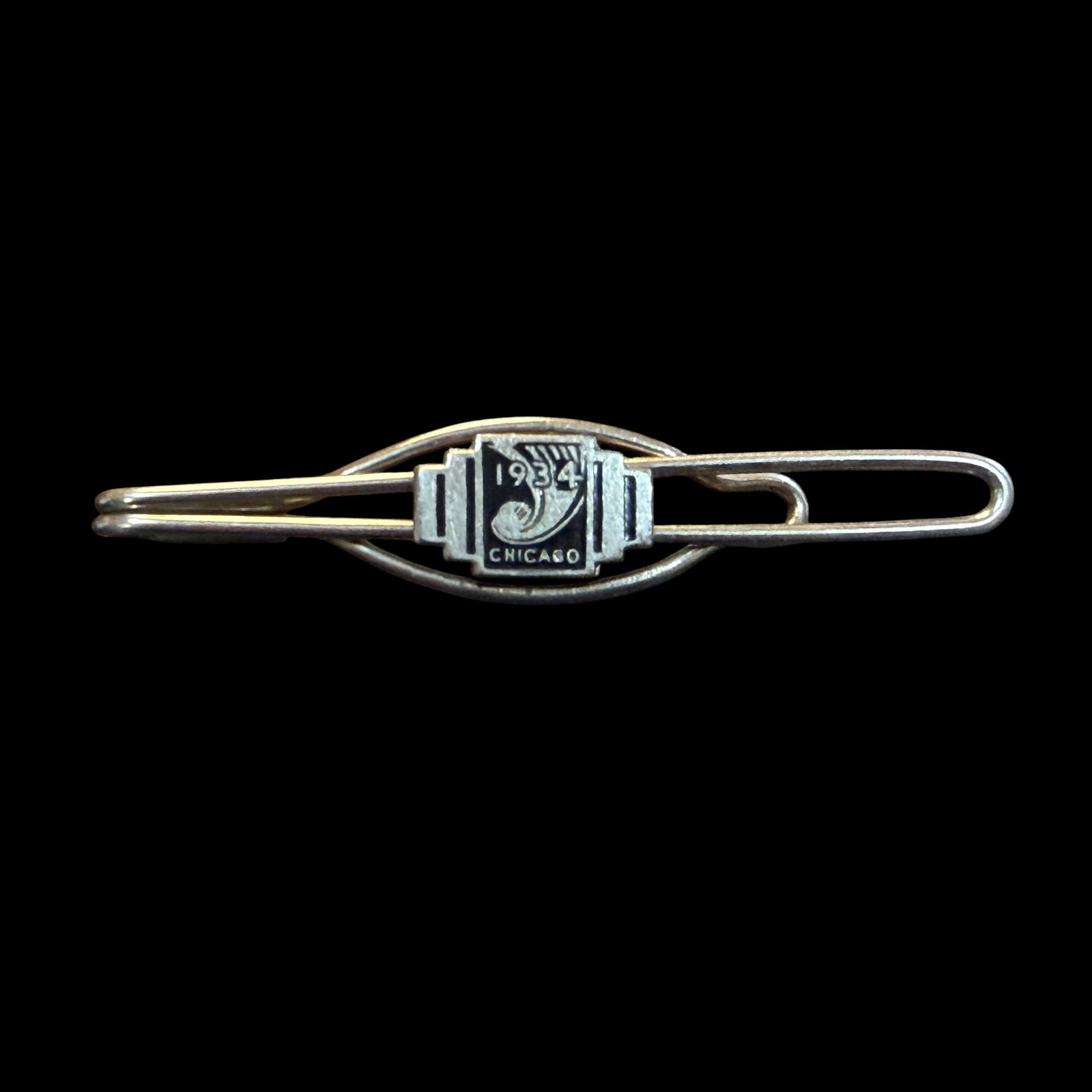 Vintage 1934 Worlds Fair Chicago Century of Progress Tie Bar Clip 2 5/8”: Maker: Unknown, made for 1934 World’s Fair in Chicago, Illinois. / Material: Base metal of some sort, likely steel for the clip portion. / Stone: None but has enameling. / Size: 2 5/8” long. /