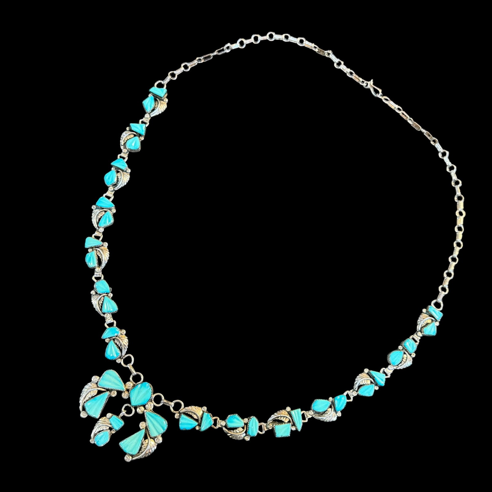 Native American Sterling Silver Carved Turquoise Squash Blossom Necklace 14.5” Signed 43.85g: Maker: Signed as shown, unknown. / Material: Sterling Silver. / Stone: Turquoise. / Size: Laid out it measures 14 1/2” top to bottom. Blossom measures 2” wide. / Weight: 43.85 grams. / Con