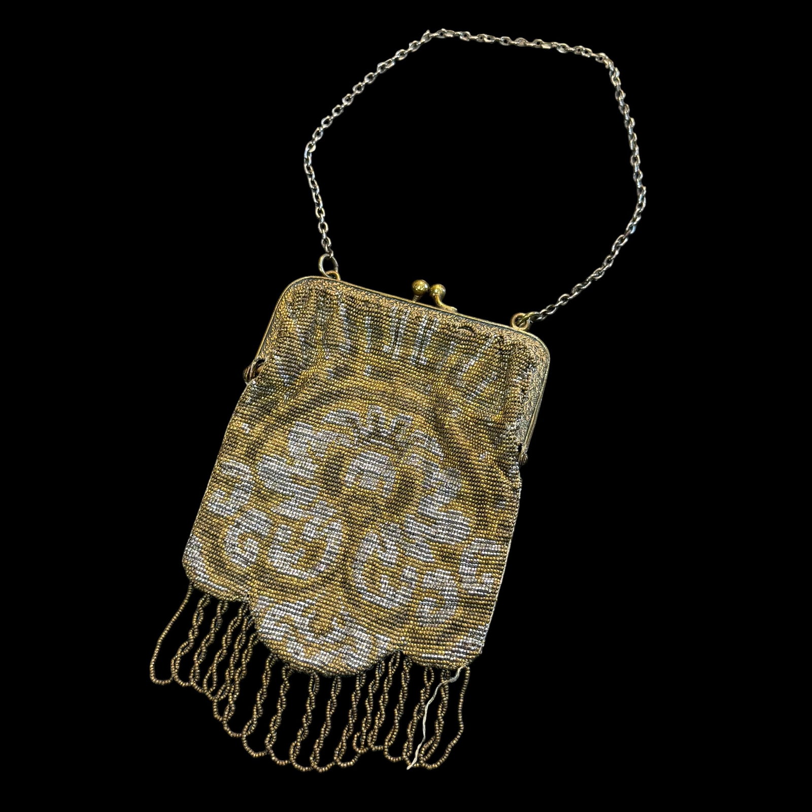 Vintage Antique Woman’s Beaded Clutch Purse Made in France Bag: Maker: Marked Made in France. / Material: Appears to be metal beads with satin lining. Possibly brass frame. / Size: Body itself measures 4” x 5”. / Condition: Great, ready to be enjoyed. 