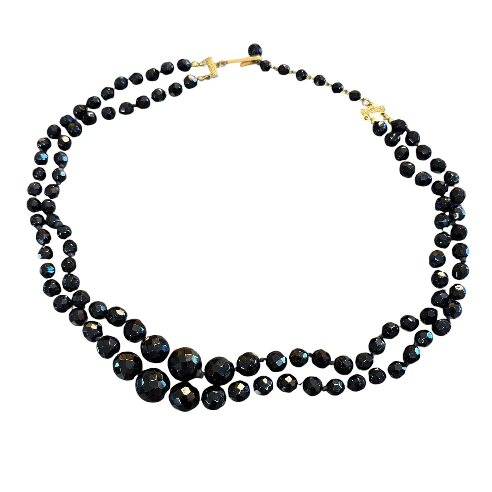 Vintage Antique Black Glass Faceted Bead Double Strand Necklace 22” Long: Maker: Unsigned, unknown. / Material: Base metal, gold tone. / Stone: Black glass beads. / Size: 22” long overall. / Condition: Great, ready to be enjoyed. / Sold as is. Measurements are approxi