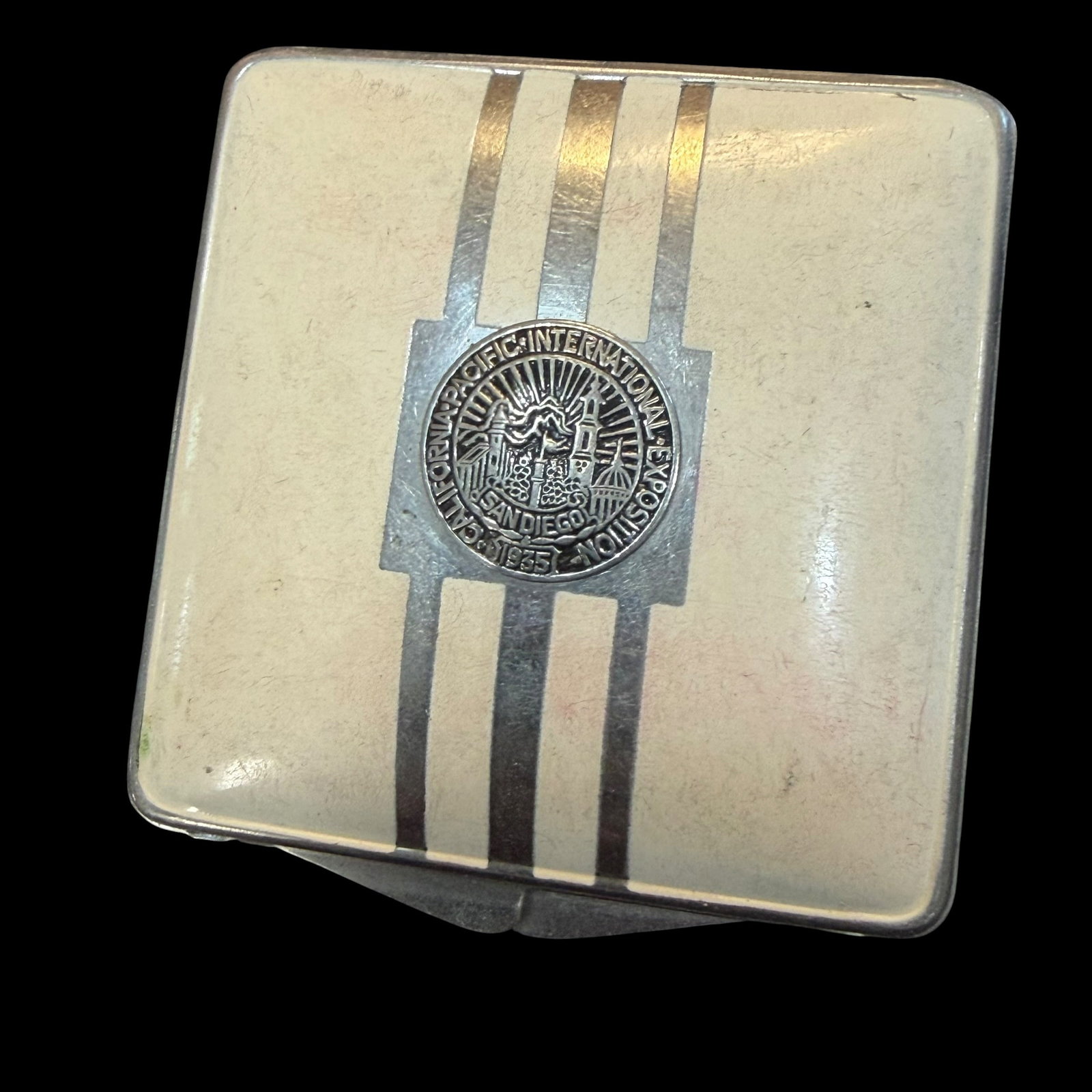 Vintage California Pacific International Exposition San Diego 1935 Makeup Compact 2 1/8”: Maker: Elgina. / Material: Base metal and some form of plastic. / Size: 2 1/8 inches square. / Condition: Great, ready to be enjoyed. / Sold as is. Measurements are approximate. Please see all photos 