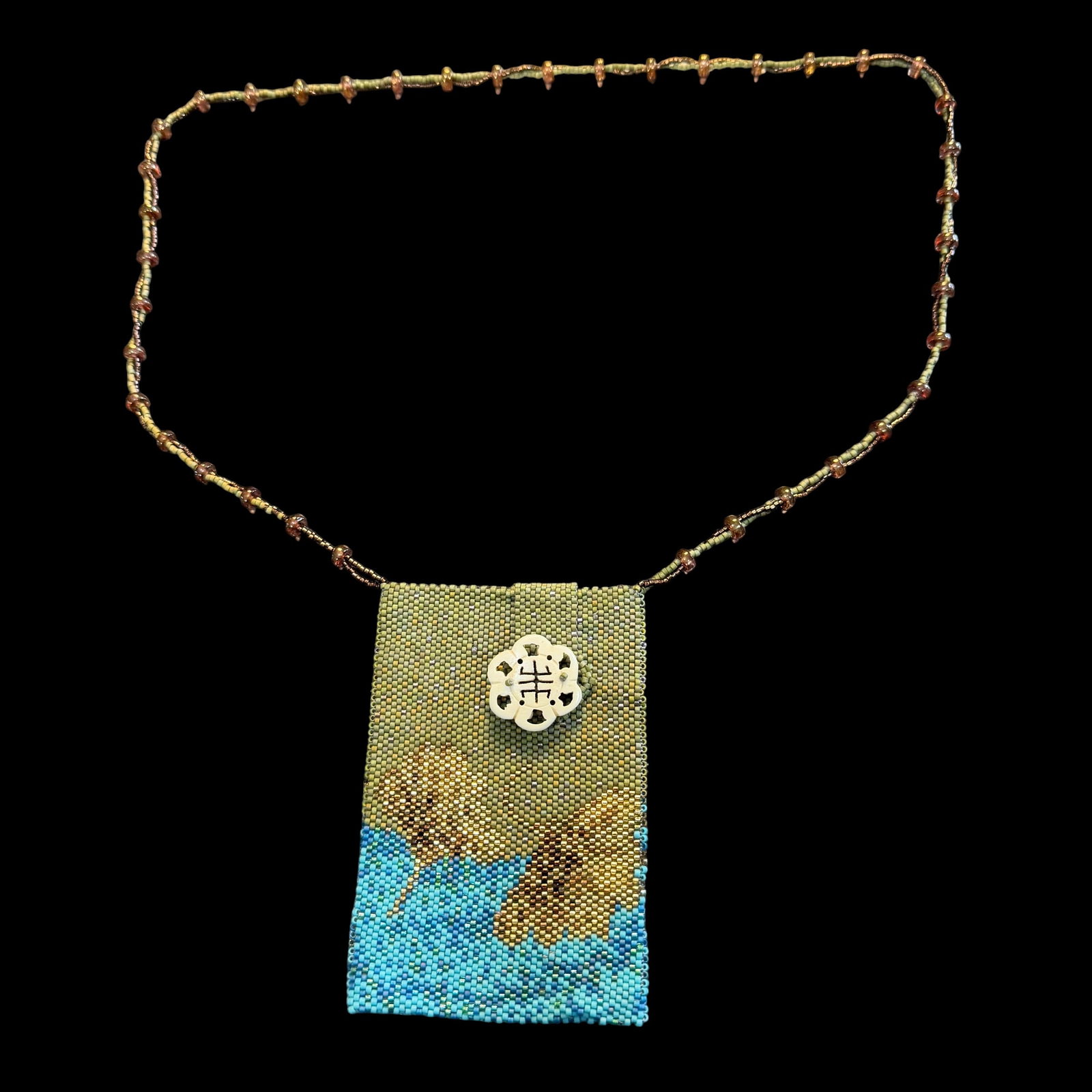 Small Vintage Glass Beaded Oriental Asian Theme Accessory Bag Carved Bone Medallion: Maker: Unknown. / Material: Glass beads, bone medallion button. / Size: Bag 4” x 2 5/8”. Overall length top to bottom 16 inches. / Condition: Great, ready to be enjoyed. / Sold as is. Meas