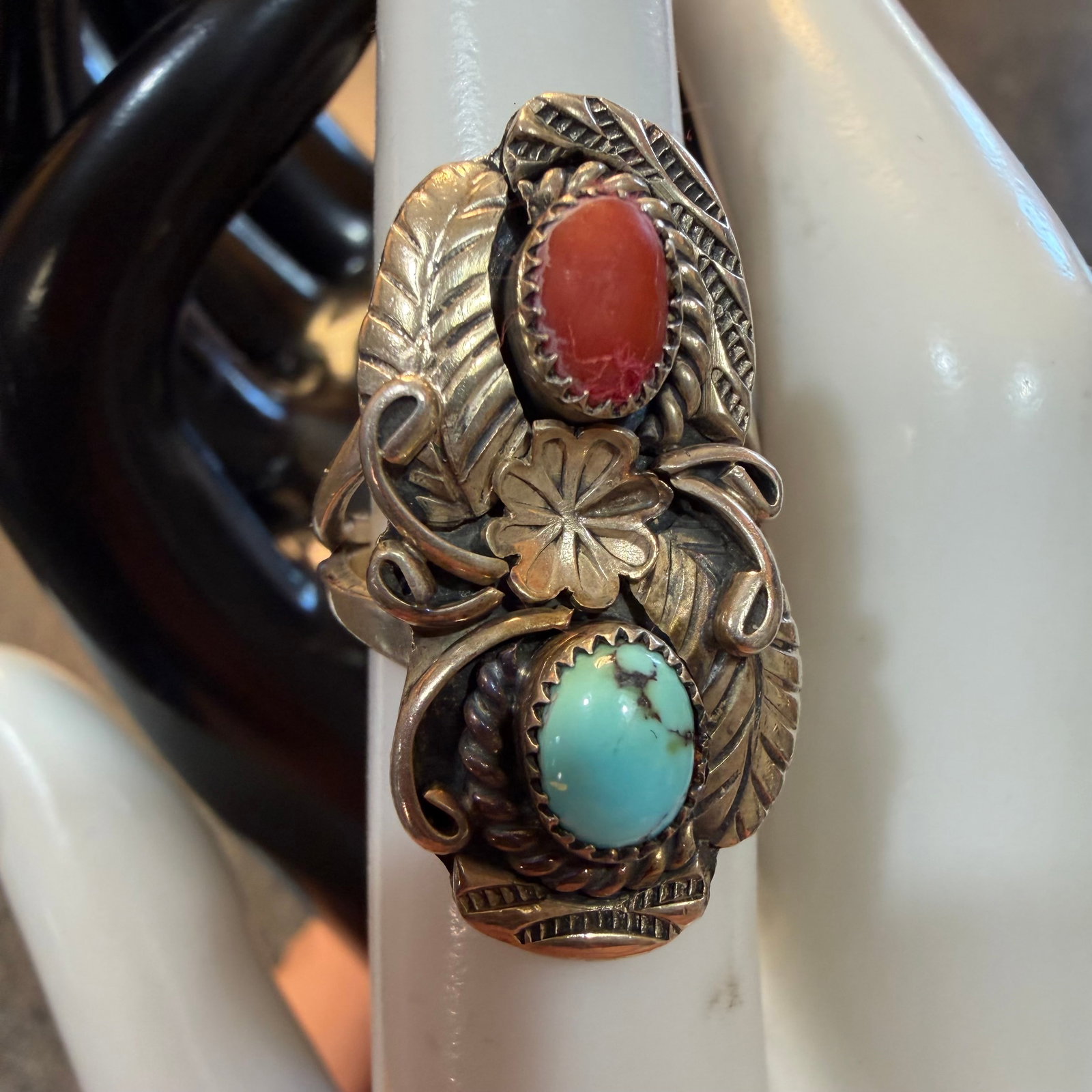 Vintage Native American Sterling Silver Turquoise Coral Ring Sz 6.25 6.38g 925 Raymond: Maker: Raymond, as shown. / Material: Sterling Silver. / Stone: Turquoise and Coral. / Size: 6.25. Face measures 1 3/16” x 5/8”. / Weight: 6.38 grams. / Condition: Great, ready to be enjoy