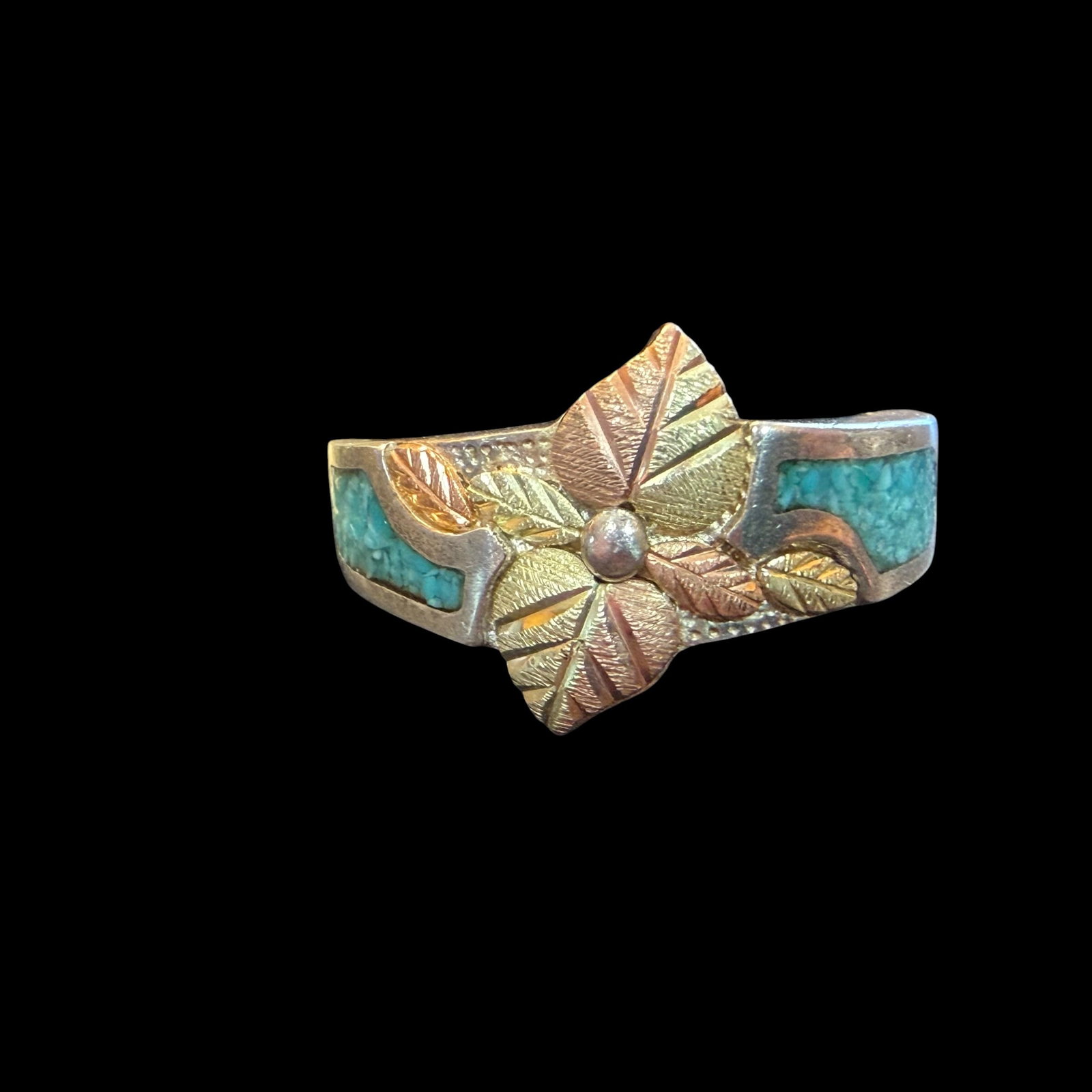 Vintage Sterling Silver Black Hills Gold 12k Turquoise Ring Sz 7.25 4.46g 925 Signed: Maker: Signed, mark shown. / Material: Sterling Silver and 12k gold. / Stone: Turquoise chips. / Size: 7.25. 1/2” wide at face. / Weight: 4.46 grams. / Condition: Great, ready to be enjoyed. / S