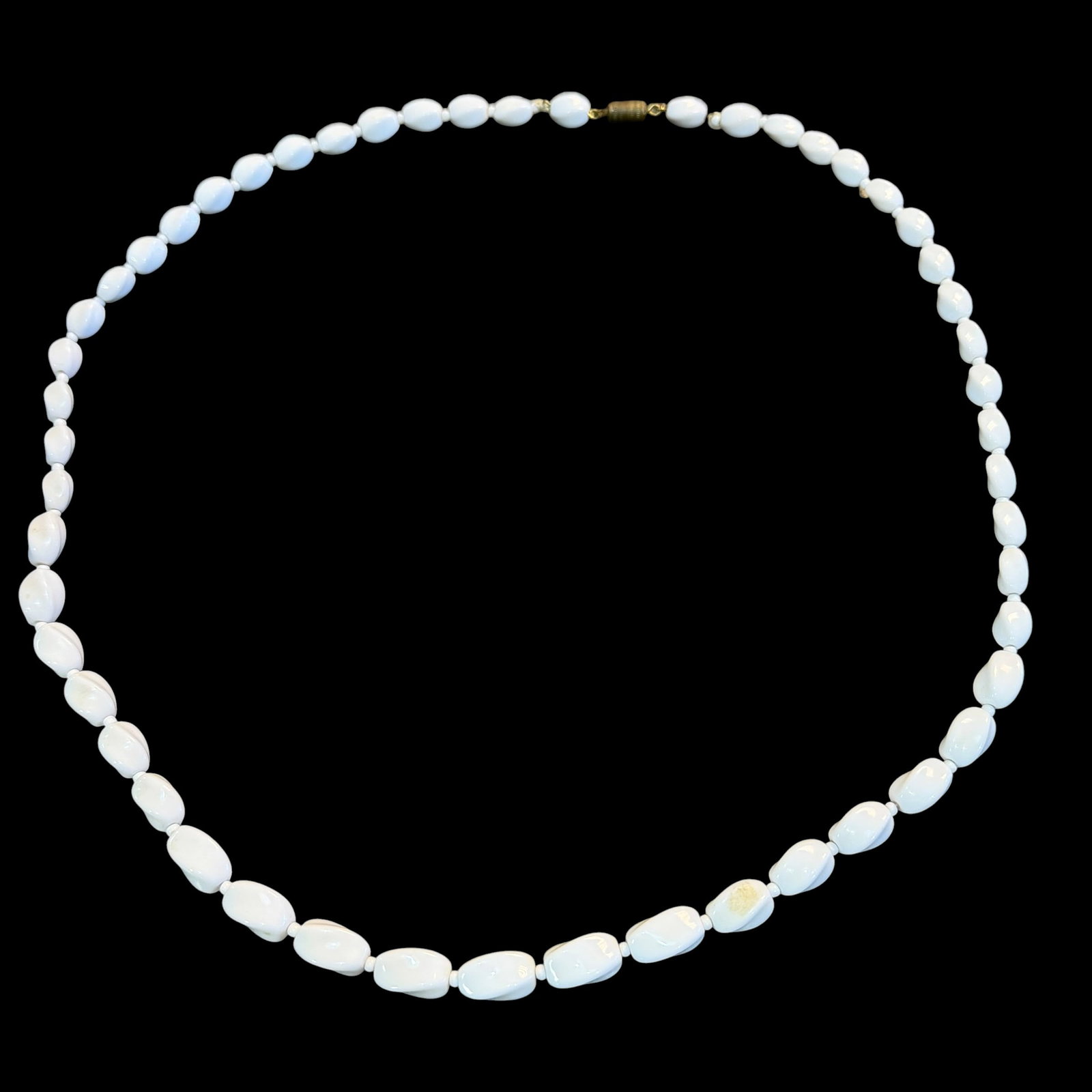 Vintage White Milk Glass Twist Bead Beaded Necklace Fashion Costume 29.5” Long: Maker: Unsigned, unknown. / Material: White glass beads with brass closures. / Size: 29 1/2” long overall. / Condition: Great, ready to enjoy. / Sold as is. Measurements are approximate. Please 